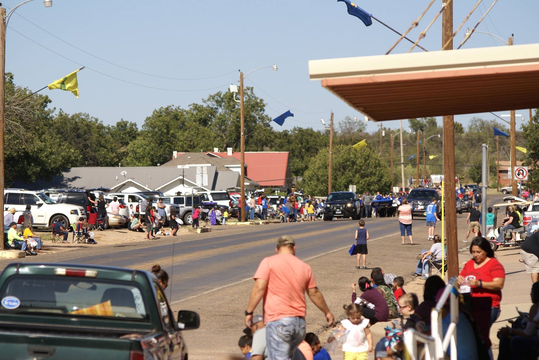 Families gathered around a street.