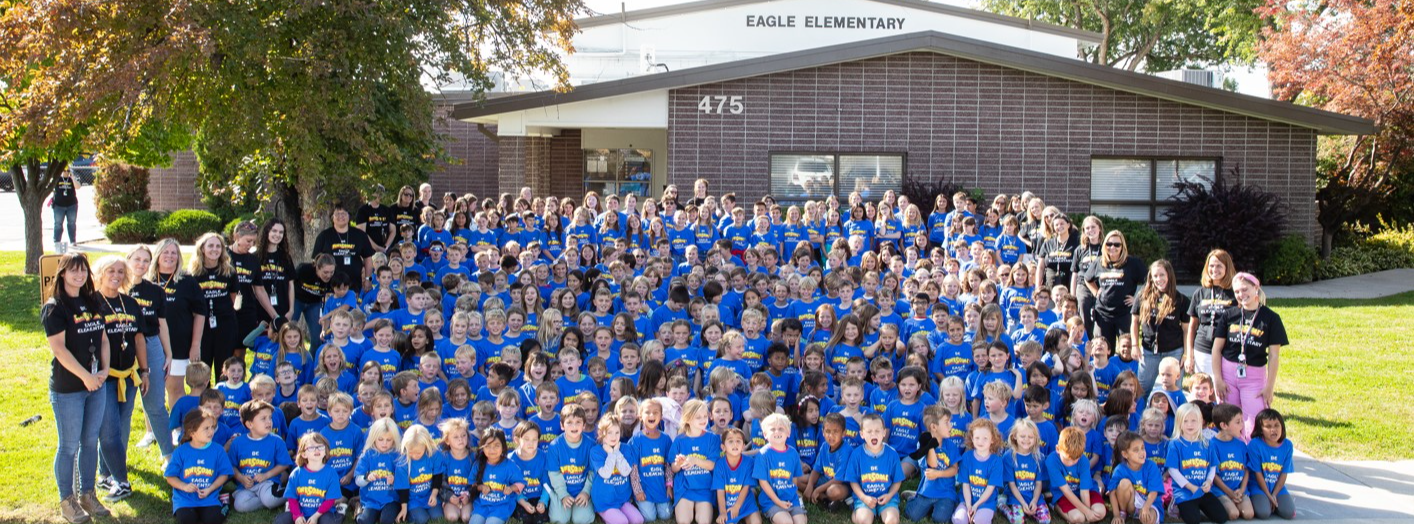 Eagle Elementary staff and students in front of the school building.
