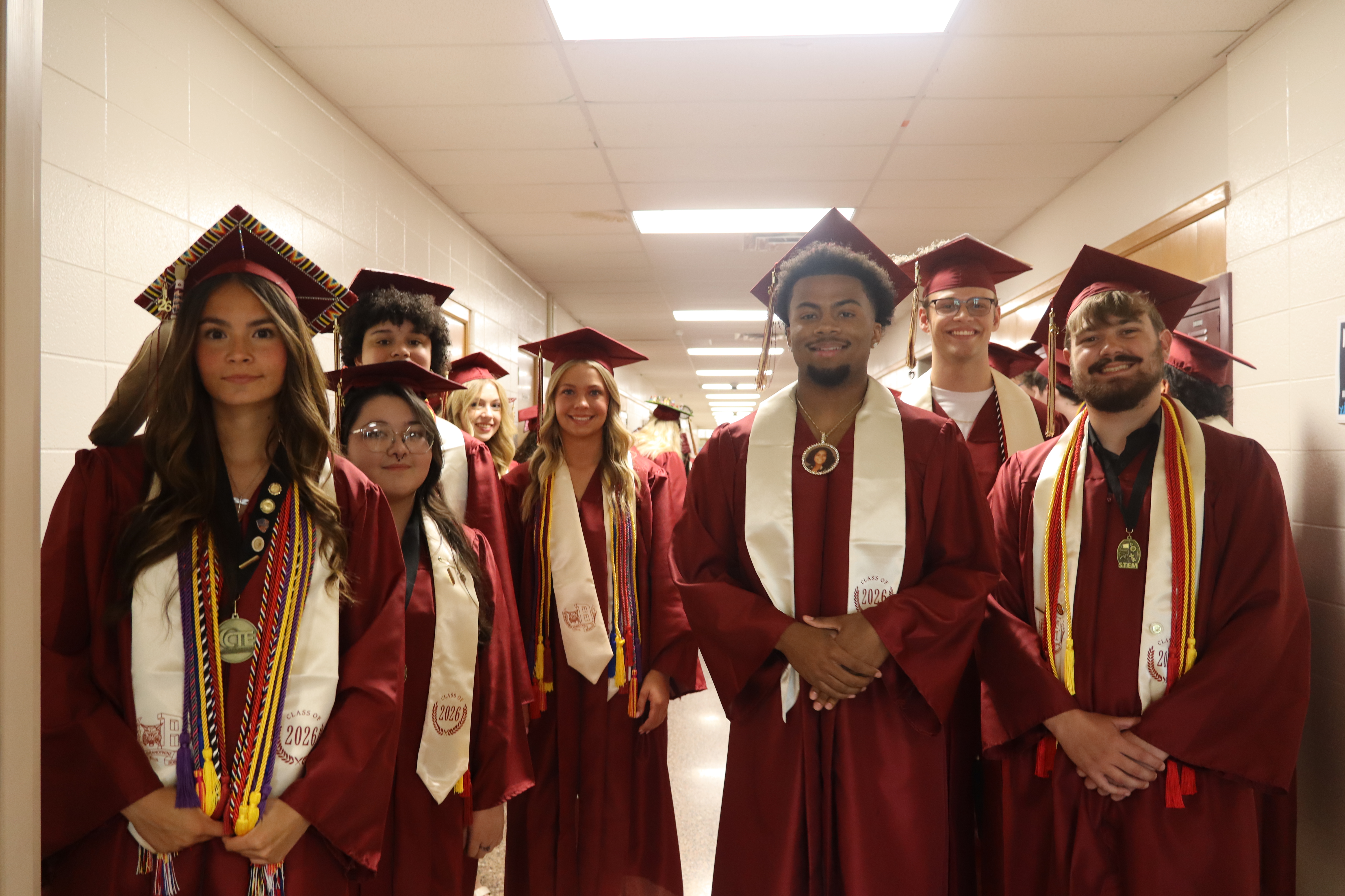 group of graduates in caps and gowns