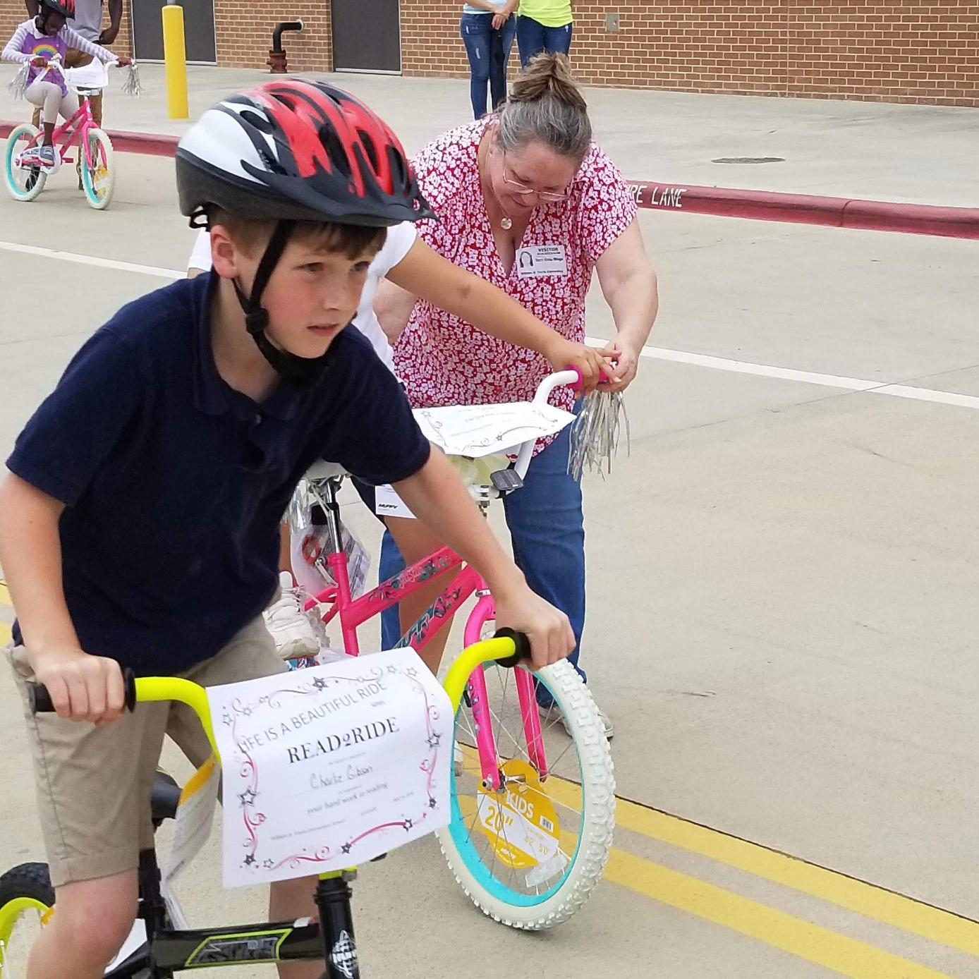 Student riding bikes from Read 2 Ride Program