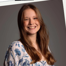 A girl with long brown hair smiling, in a photo pinned with a white border. "ACE of the Week" is written in red.