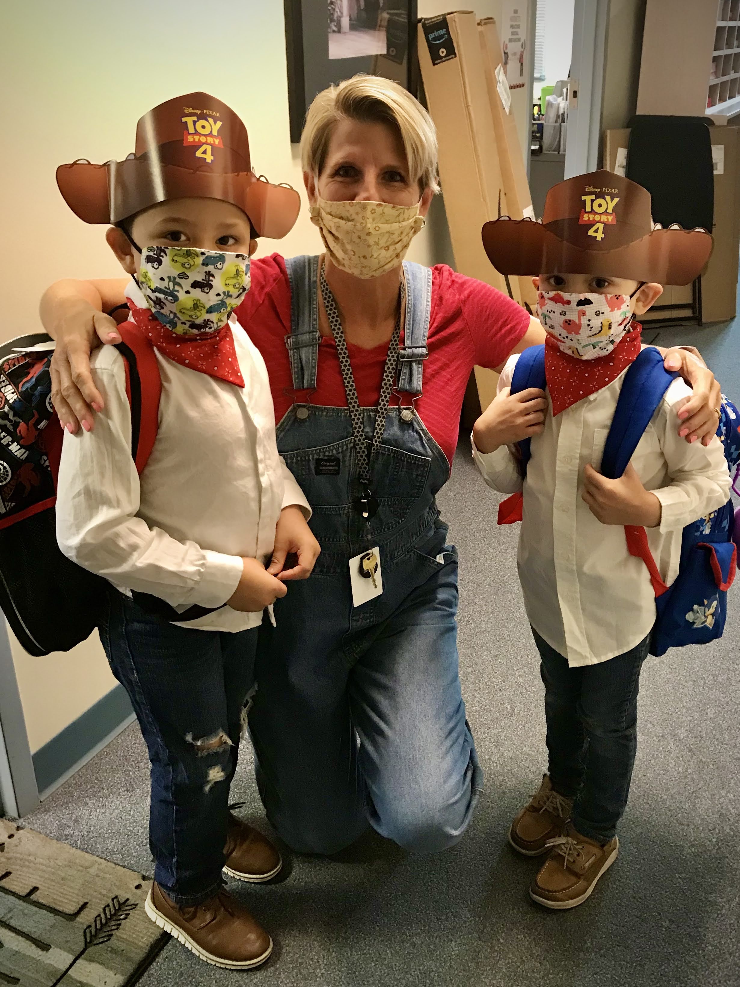 Teacher and two students dress as cowboys