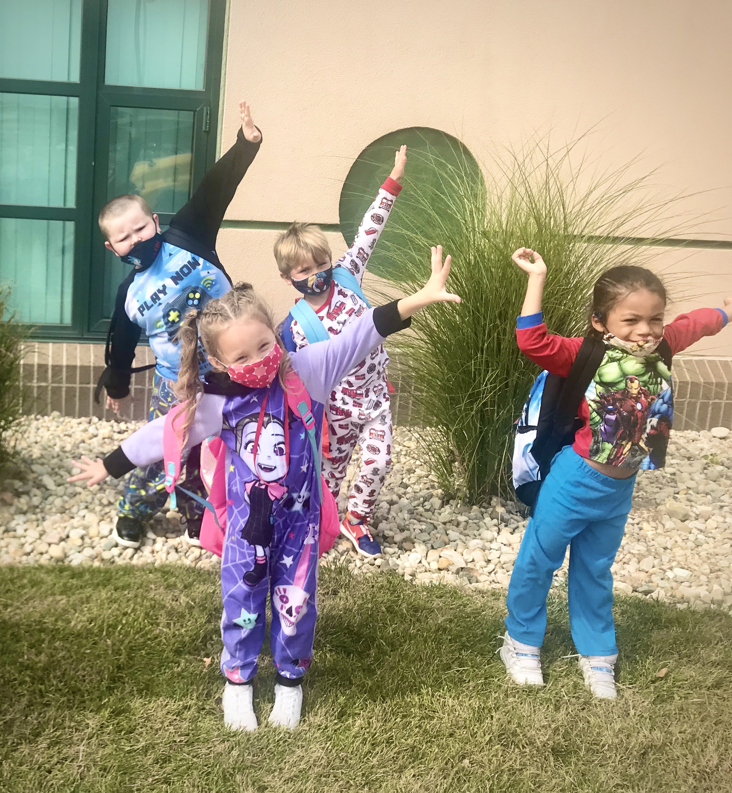Four students dressed in PJs