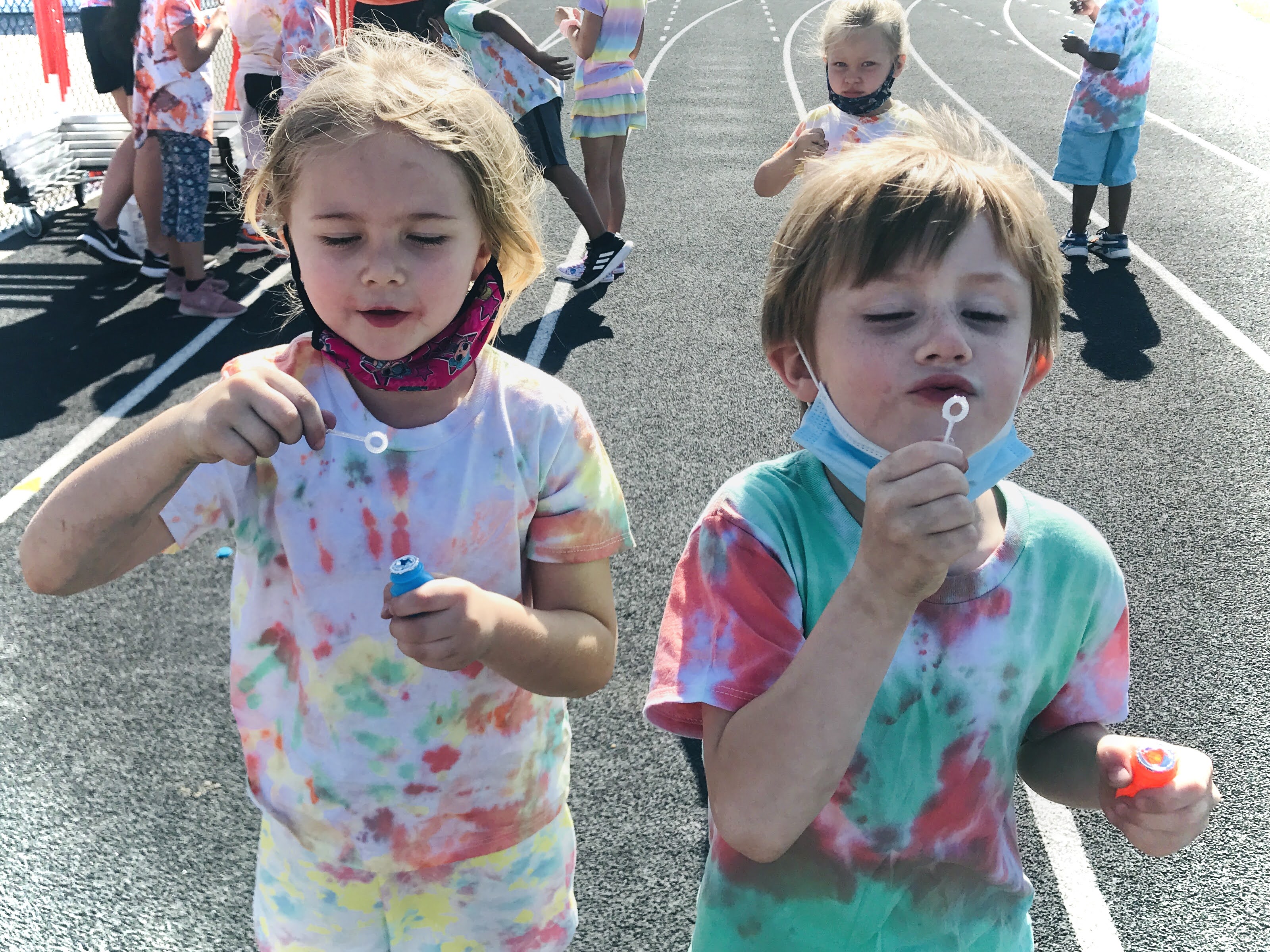 Two students blowing bubbles