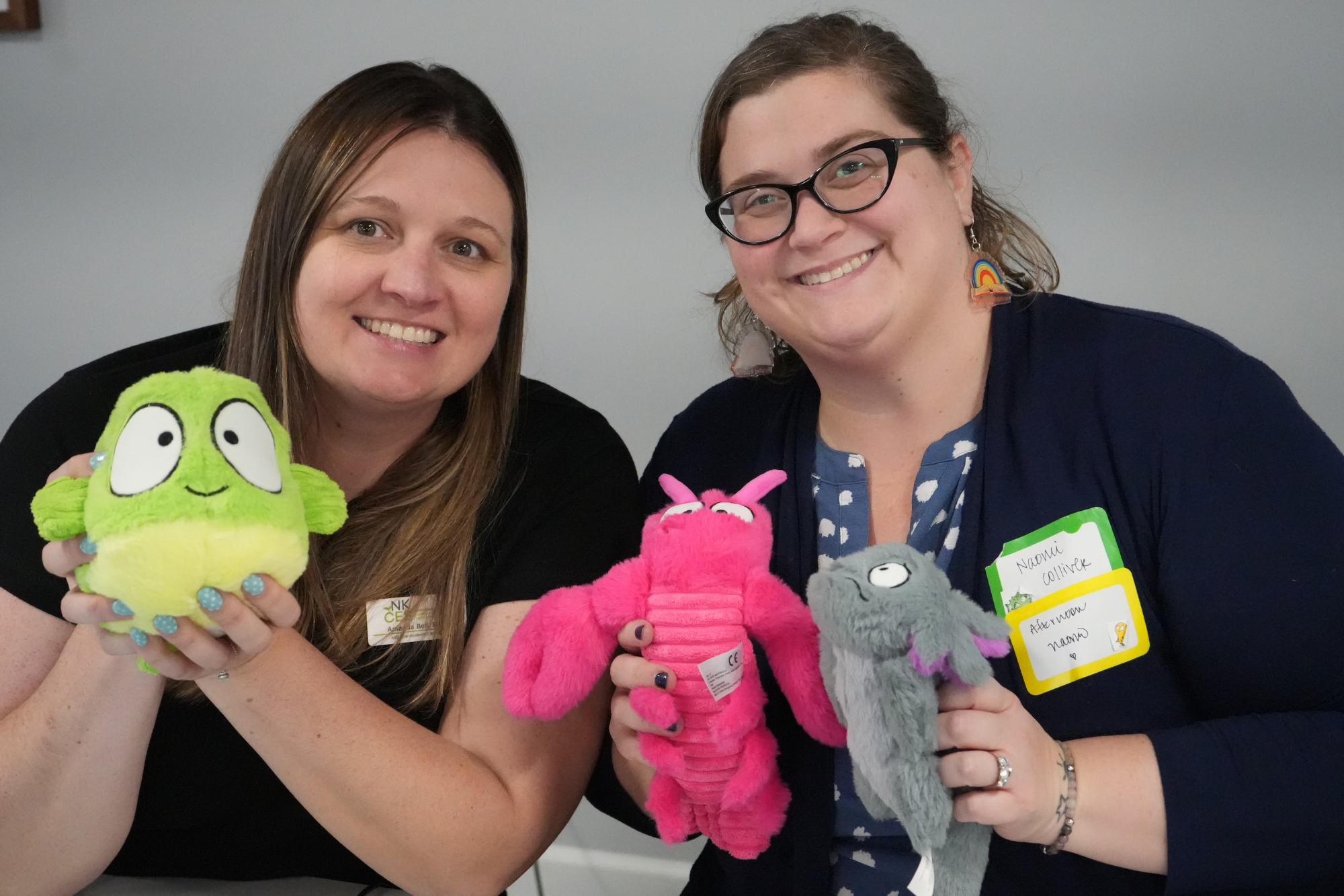 Naomi and Amanda holding stuffed toys