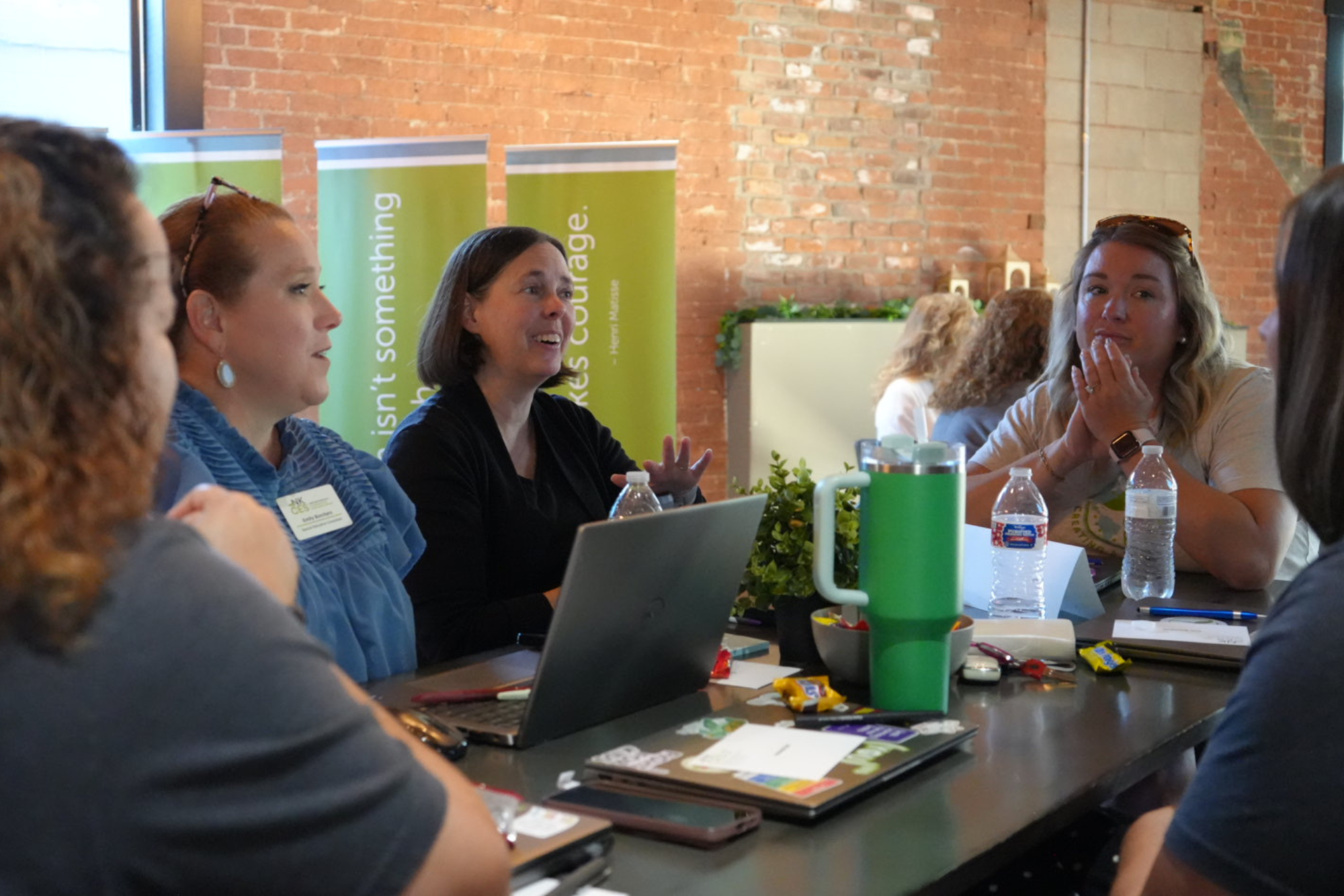 IDEA team having a discussion around a table