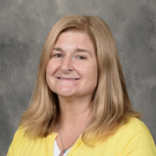 blonde haired woman wearing yellow shirt