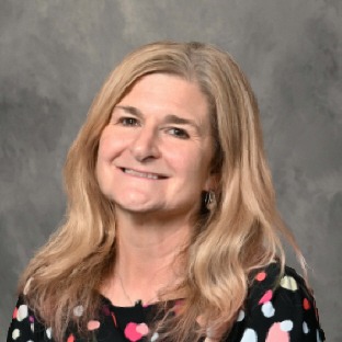 blonde haired woman wearing polka dot shirt