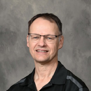 man with glasses wearing black polo shirt