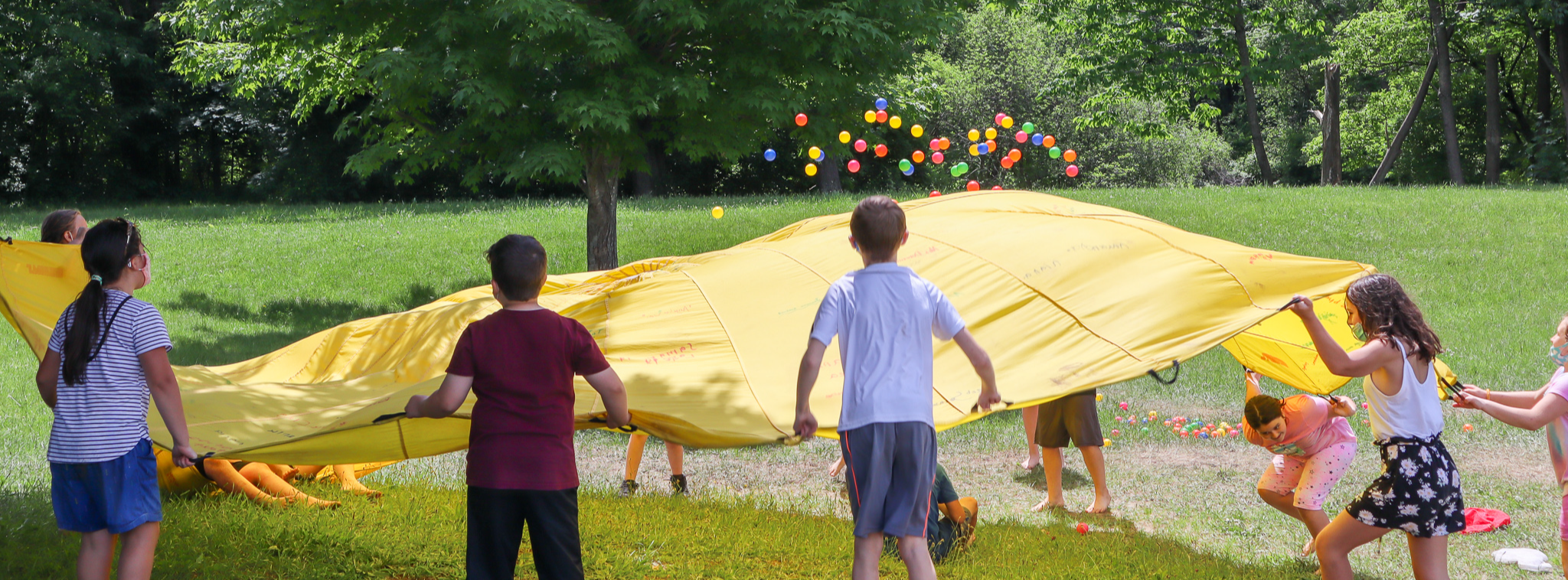 Students playing parachute outside