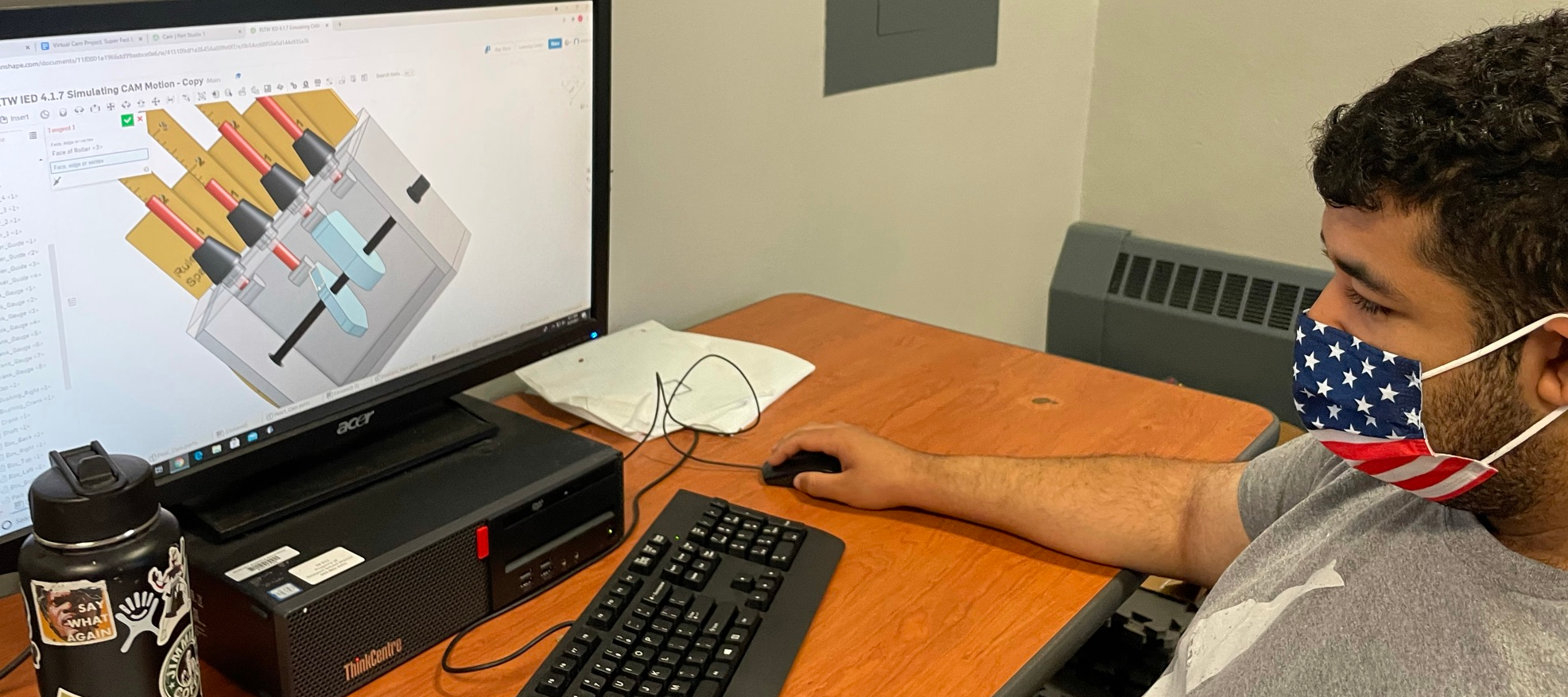 Pre-Engineering Student creating 3D model on his computer