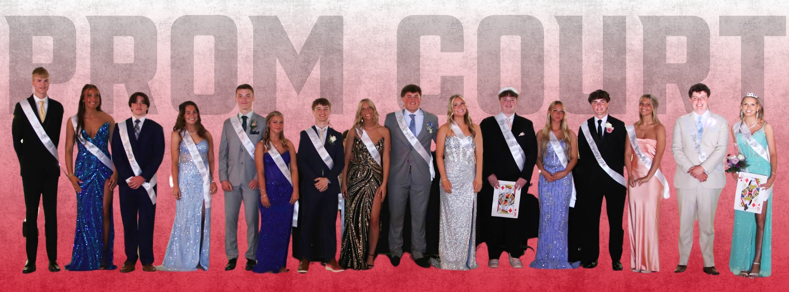 Prom court members in formal attire stand in a row on a red carpet, facing the camera.