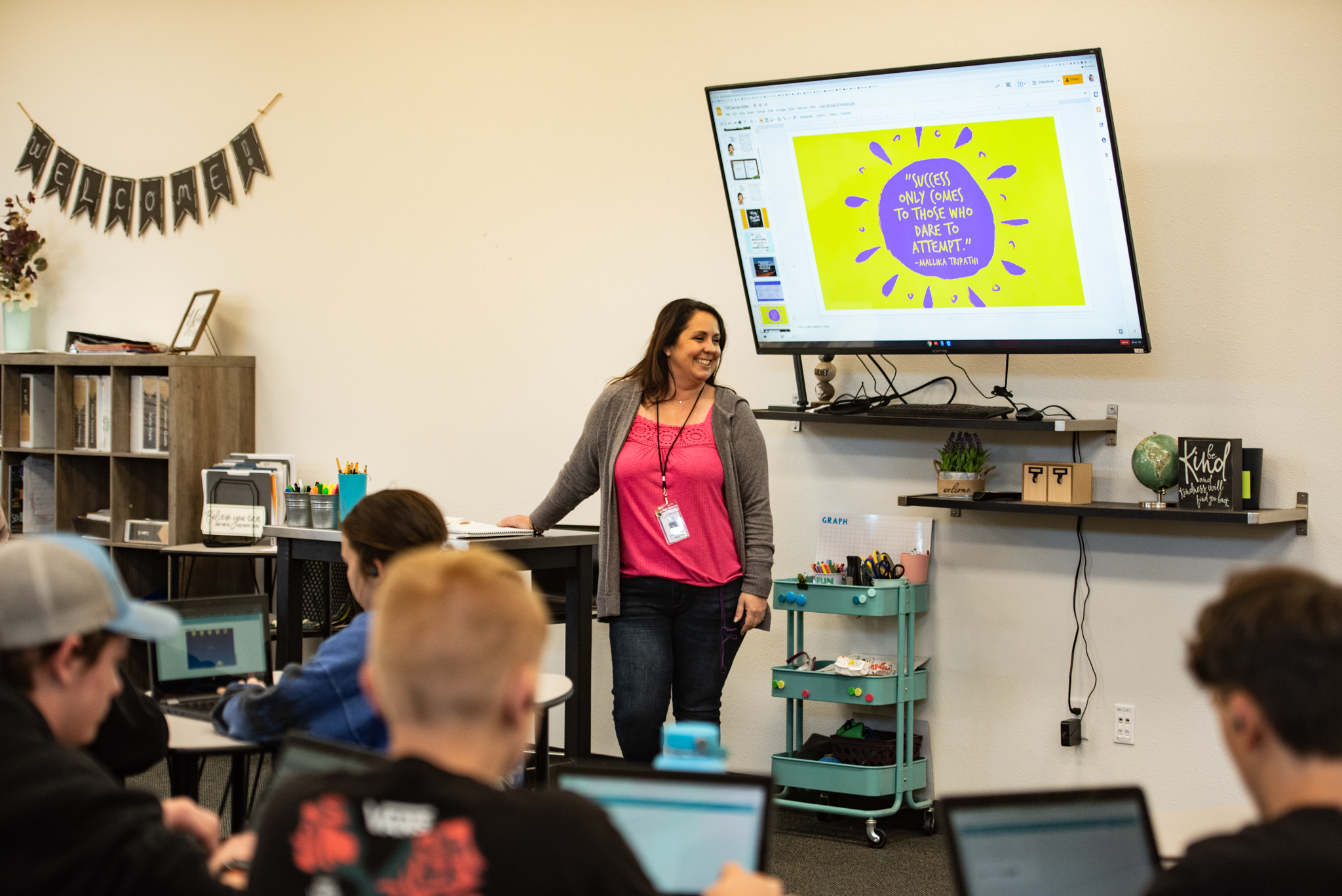 teacher in front of class speaking to students