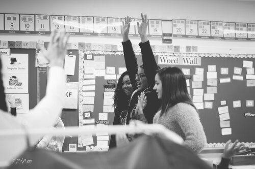 students interacting at black history month celebration