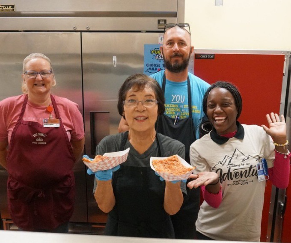 Hawthorn Elementary cafe crew show off rectangular pizza at lunch 