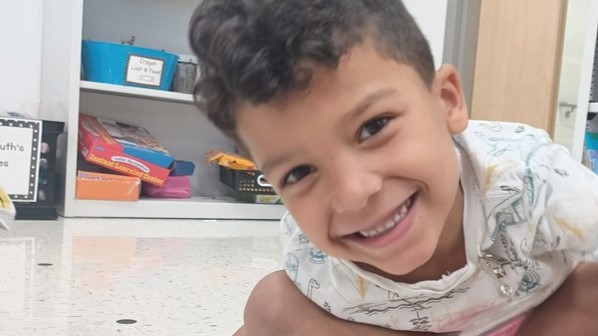 It's all smiles during math time for this kindergartener