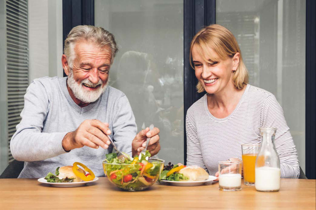 Two adults eating healthy