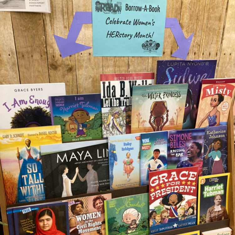 picture of book case featuring titles for Women's History Month