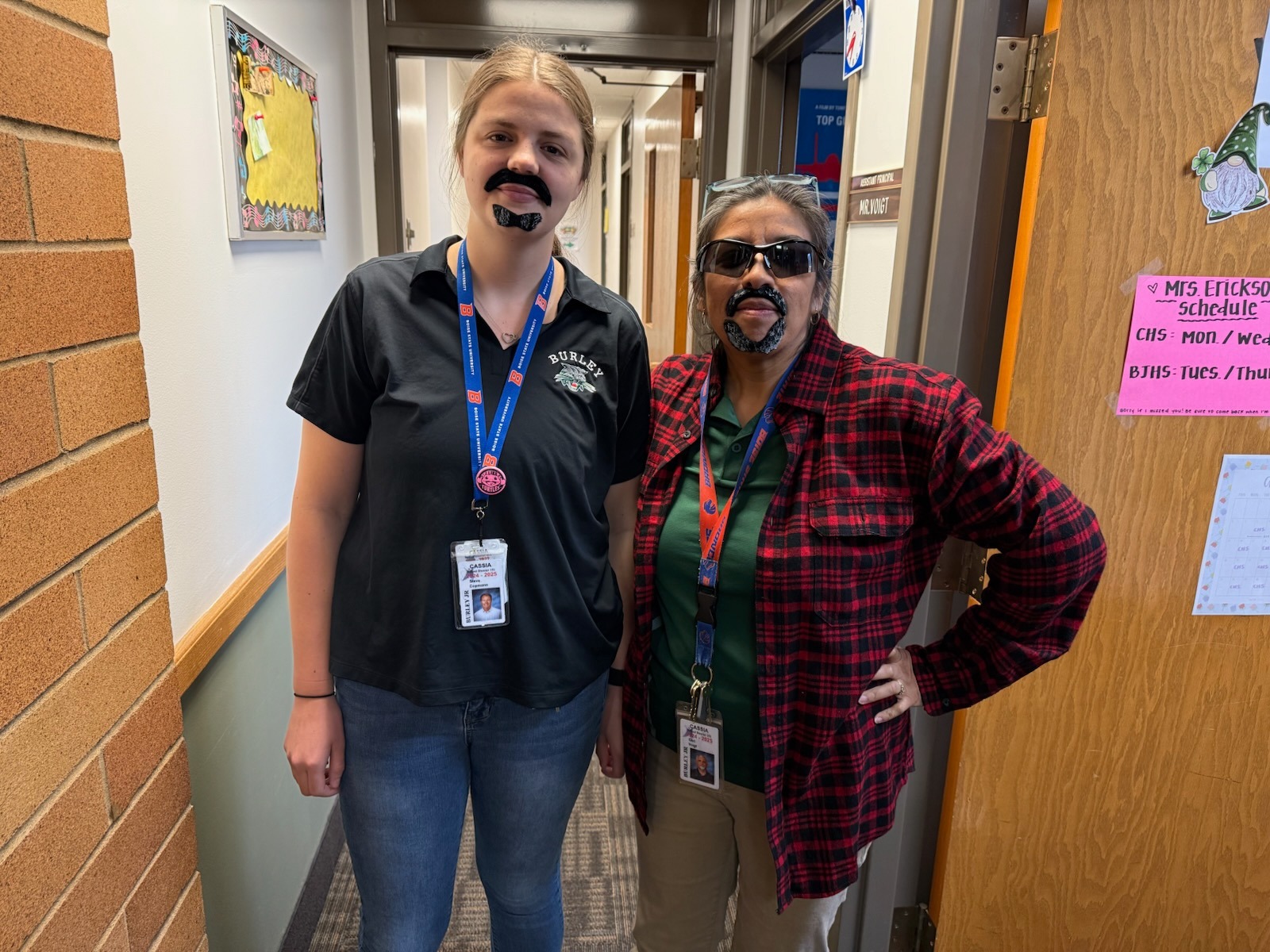 picture of Becca and Liza in the office dressed up as Carl Voigt
