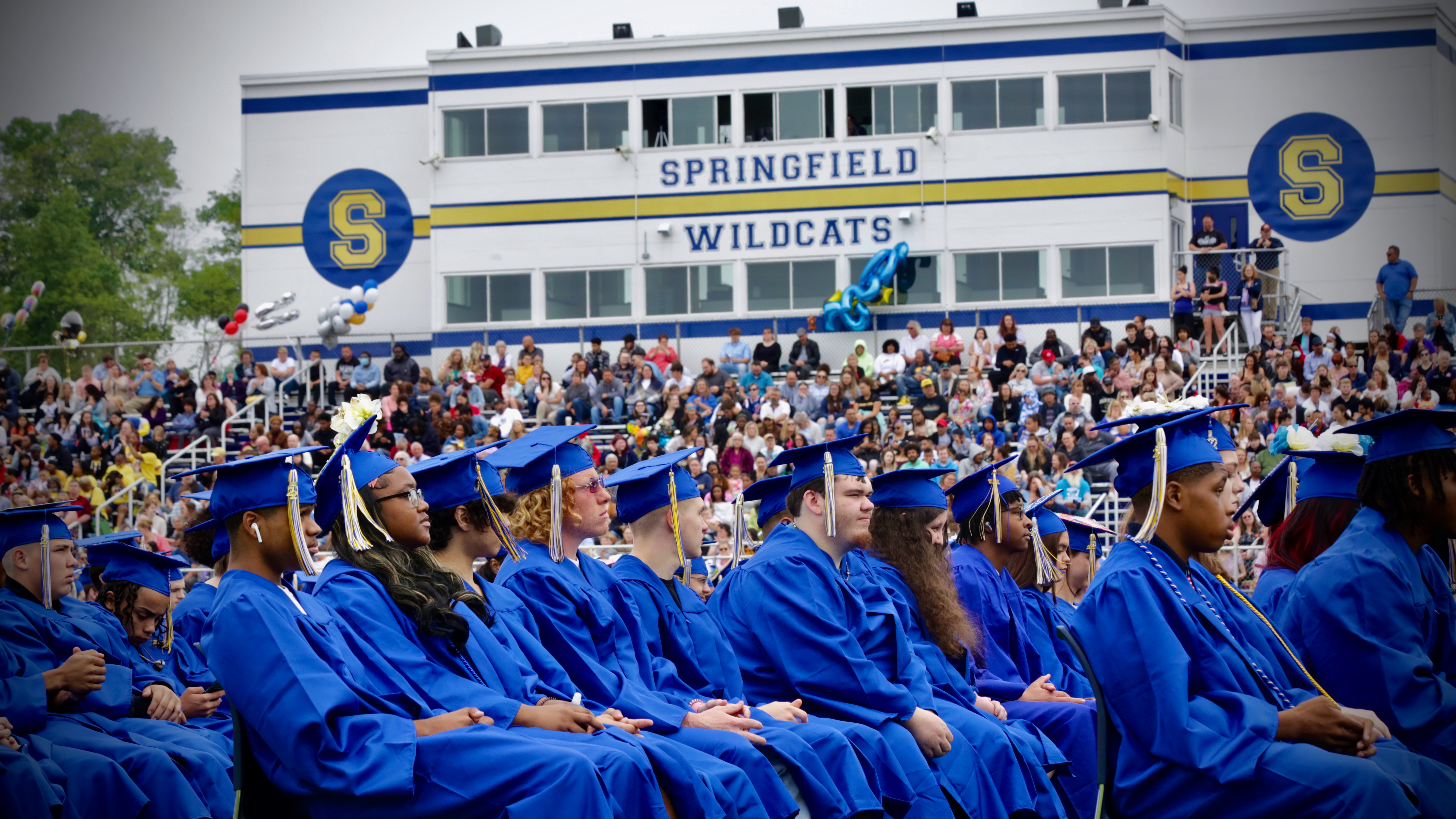Class of 2022 graduates look on during their commencement ceremony 