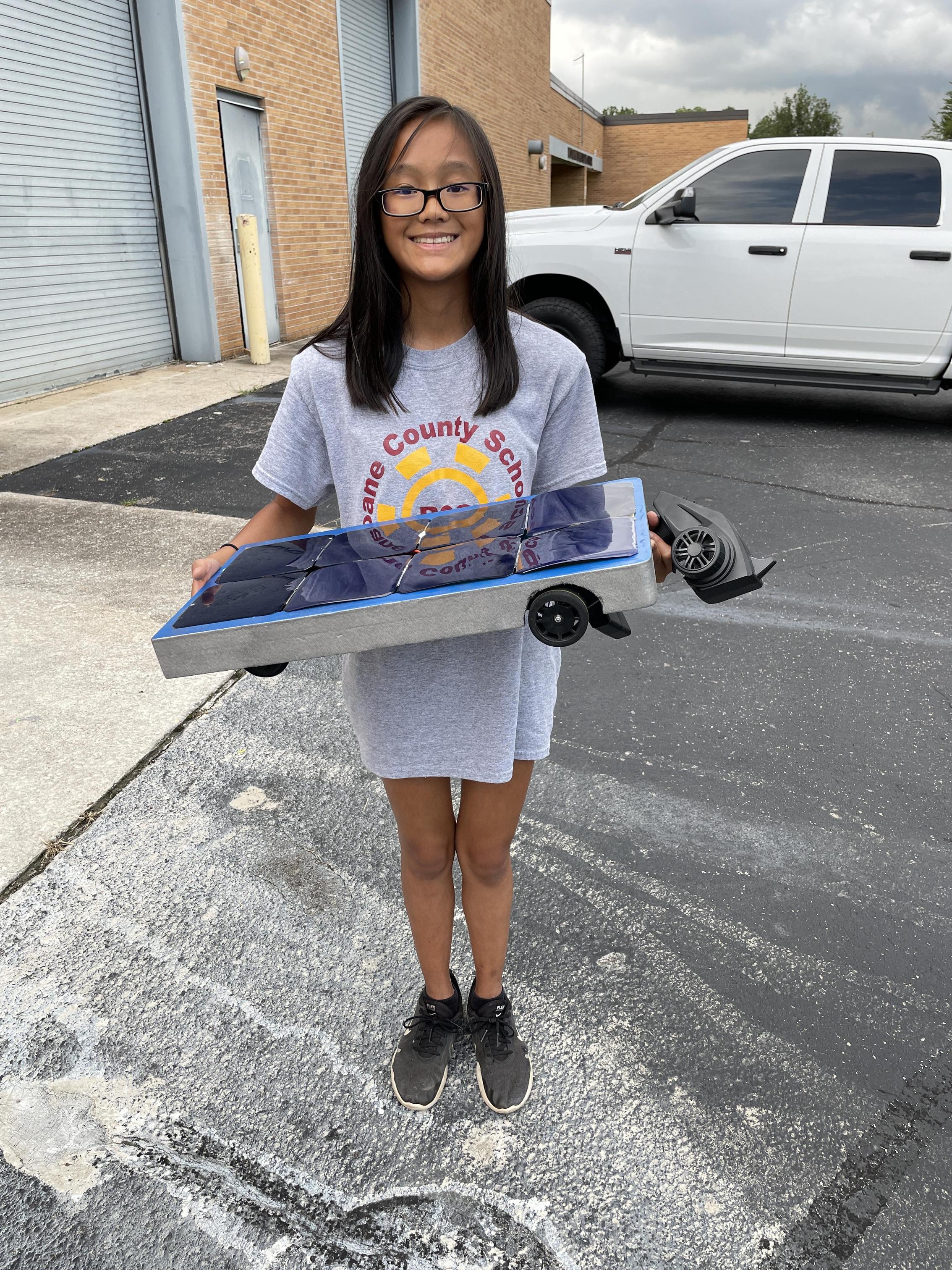emma holding her solar racer