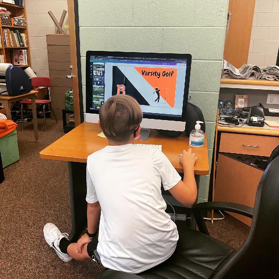 Student editing graphics in Canva for weekly announcements.