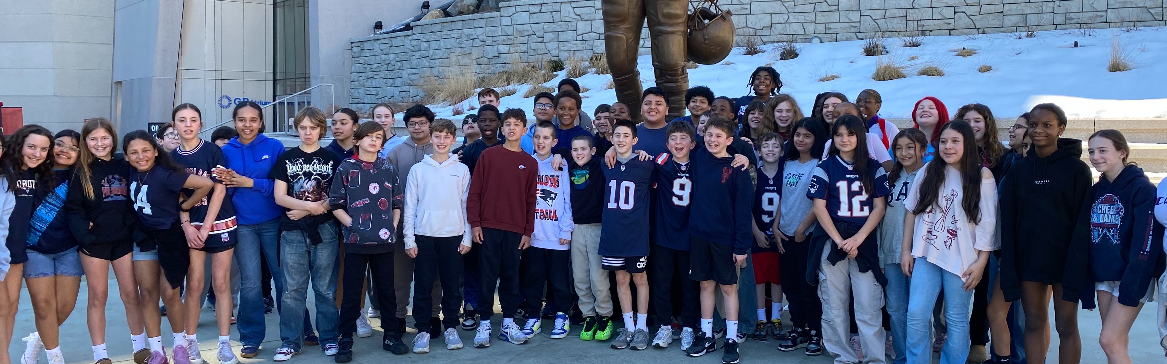 Class in front of statue