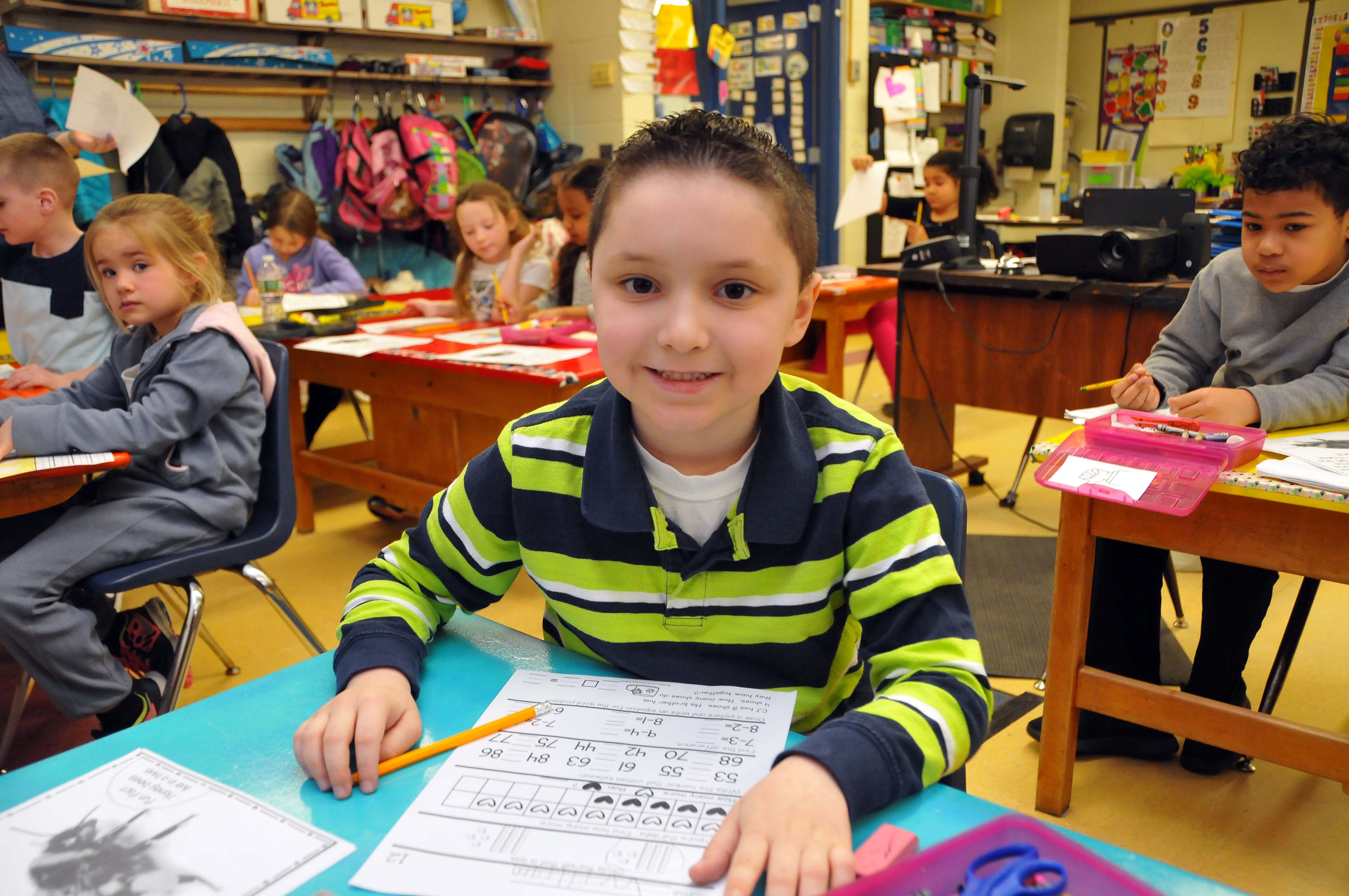 Kid sitting at desk