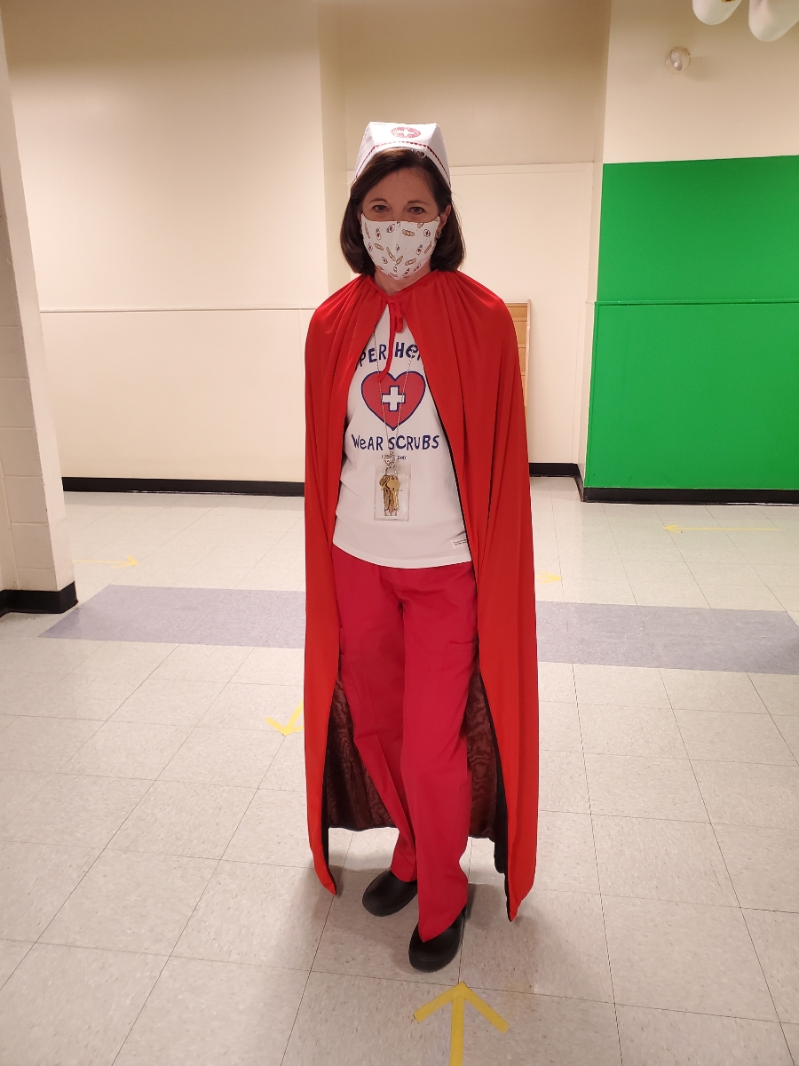 Mrs. Pfeiler dressed up as a Superhero for Halloween, as part of the 2021-2022 school year theme at Warwick Neck Elementary.