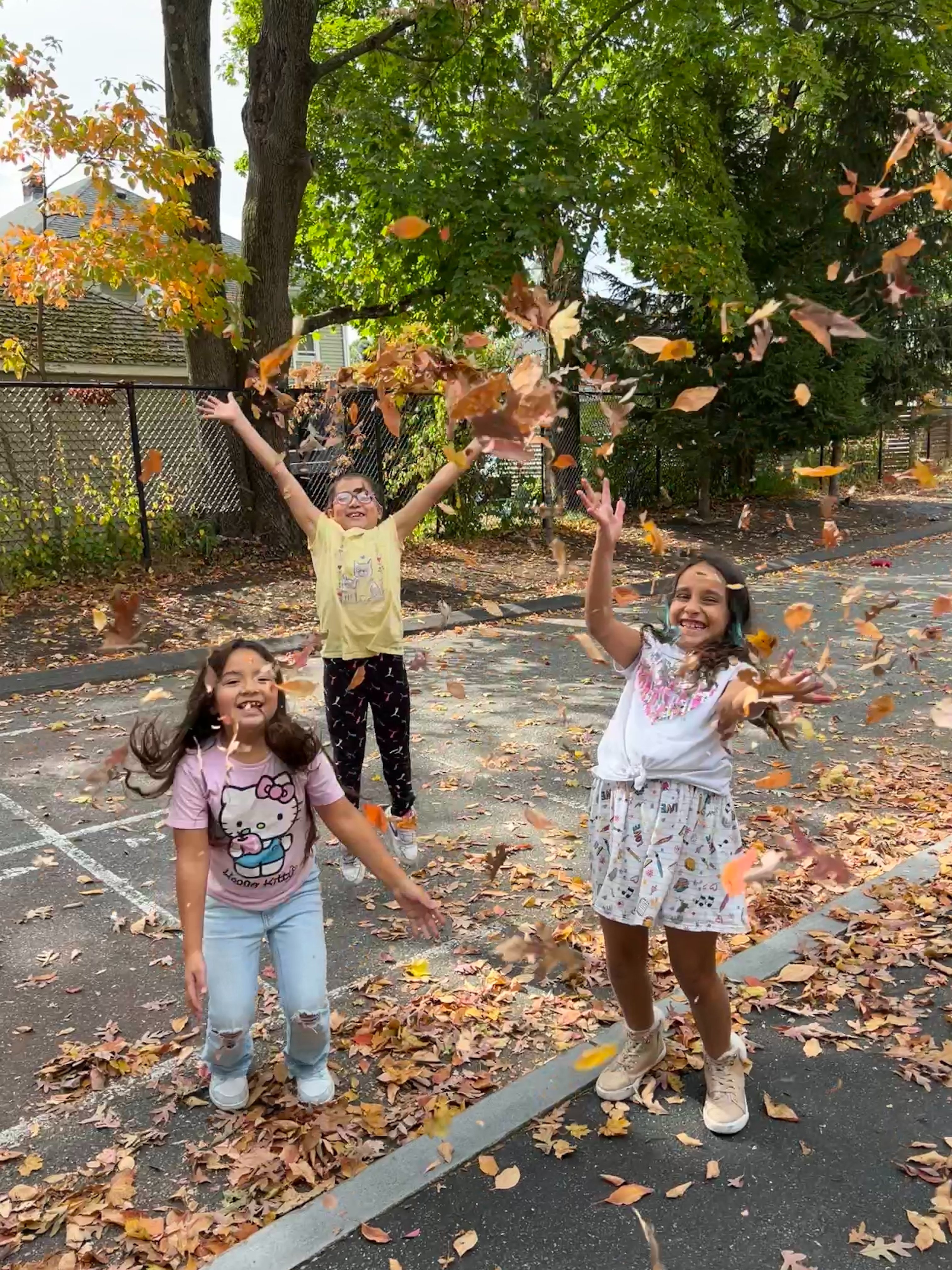 Students in Fall Leaves