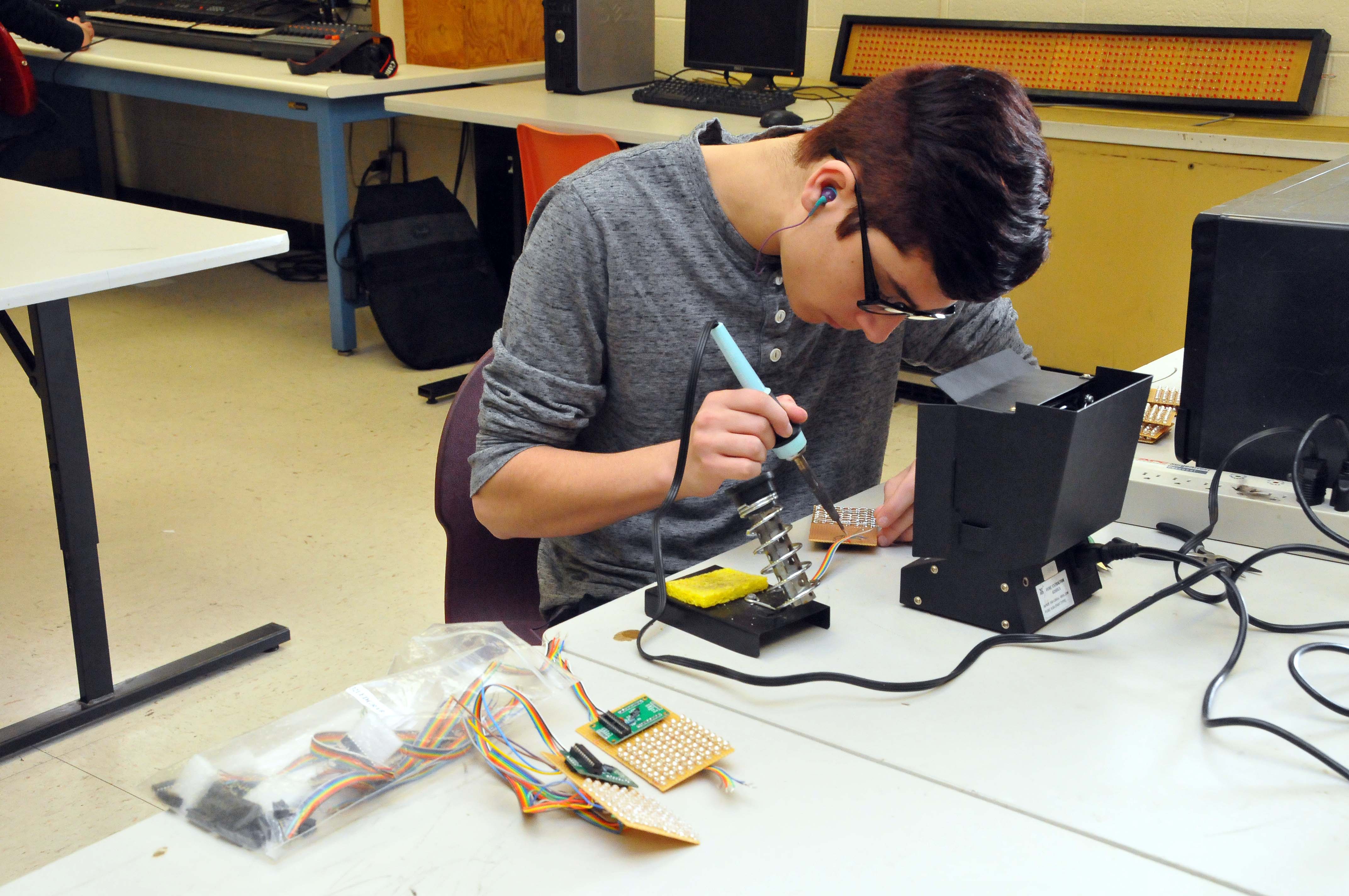 Teen working in a project at school