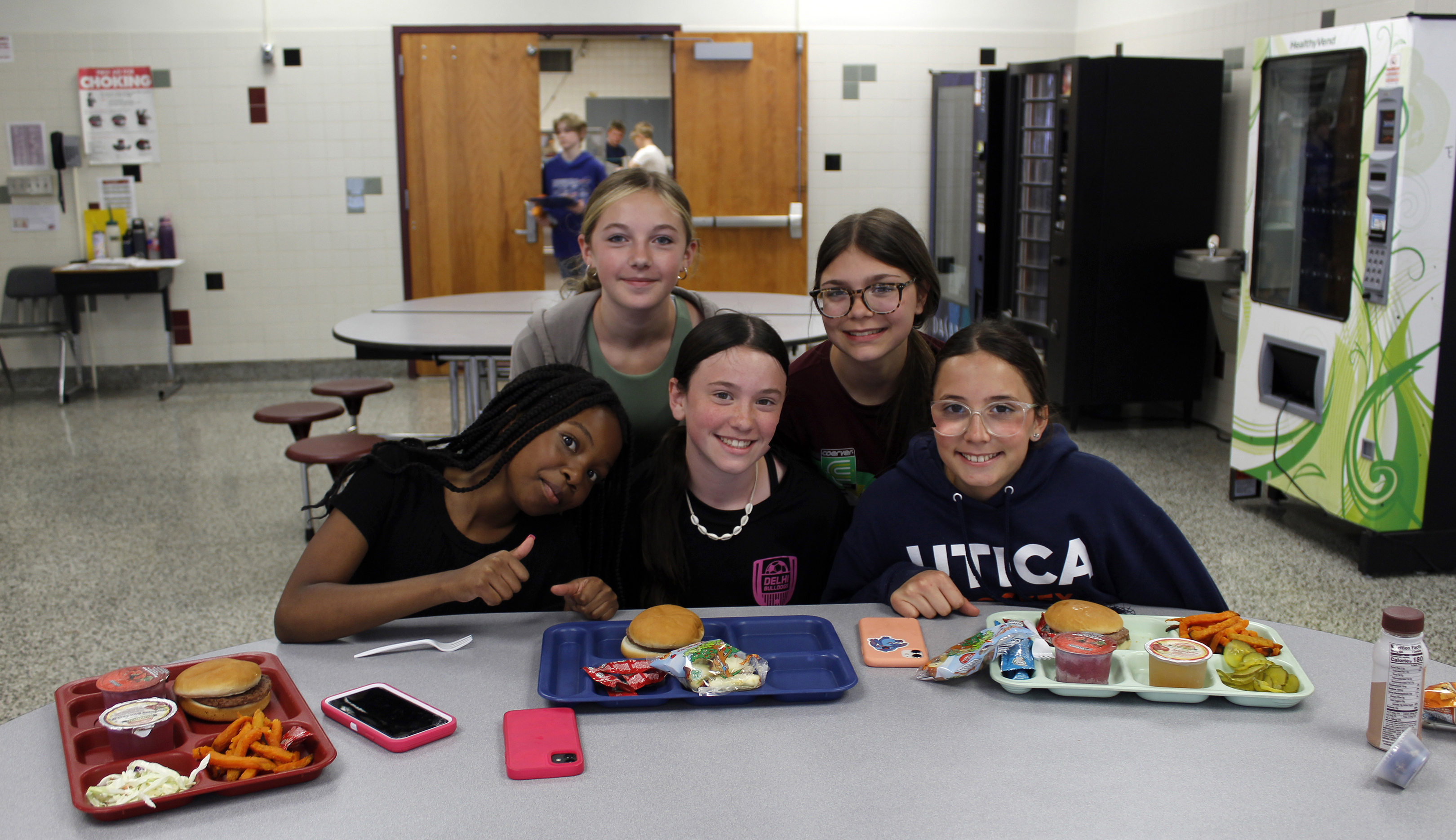 students smiling with lunch