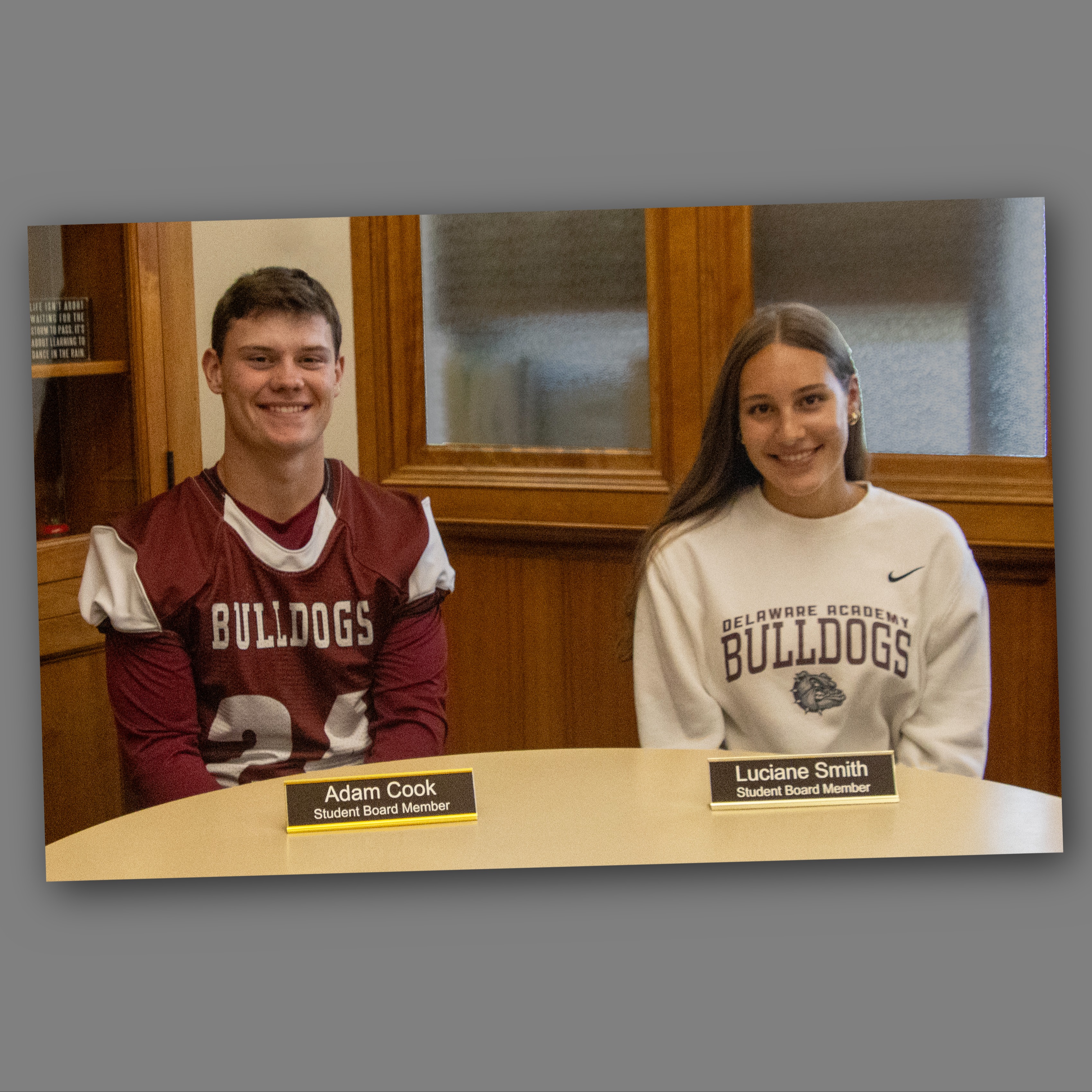 Adam Cook and Luciane Smith, with nameplates