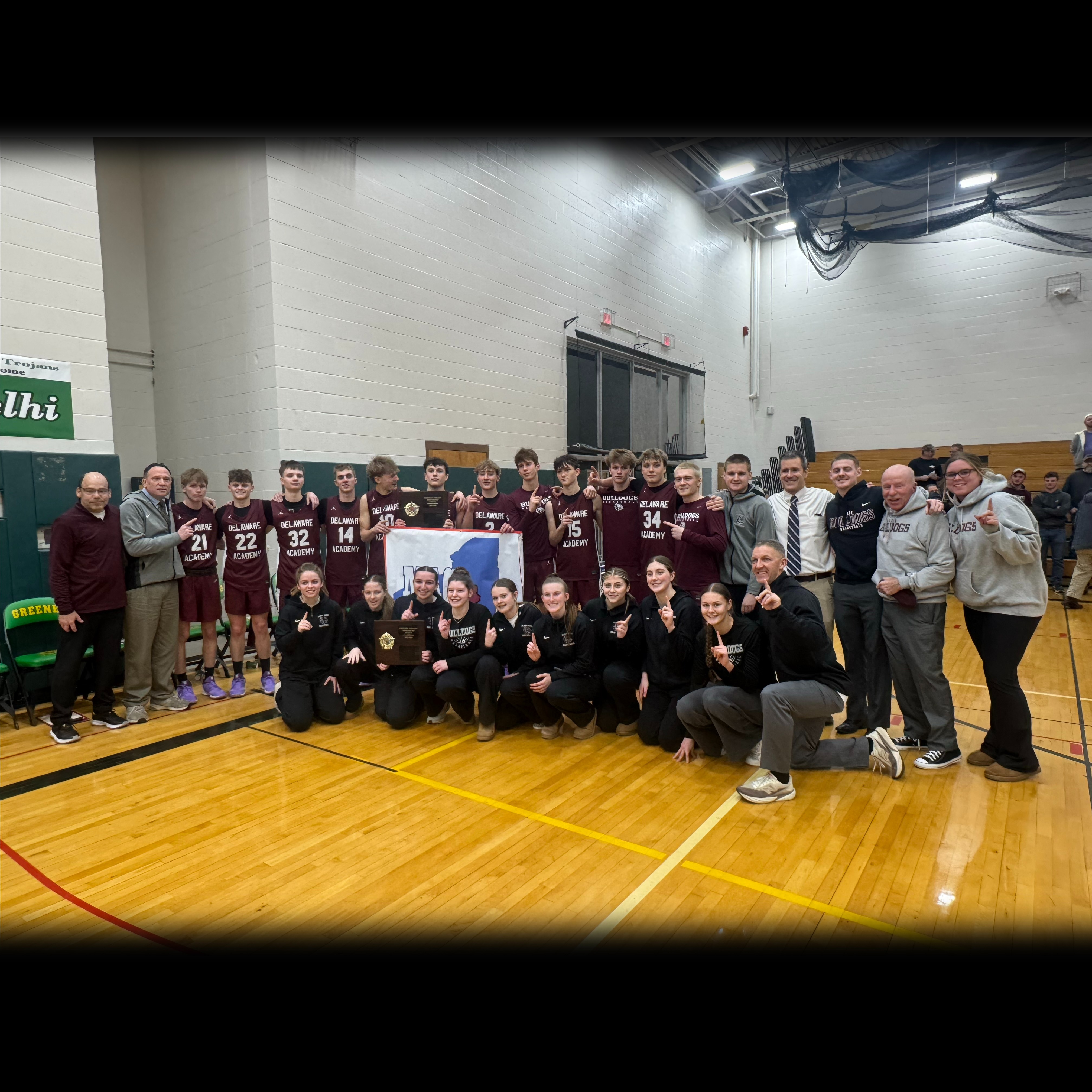 group photo of boys and girls varsity basketball teams and coaches