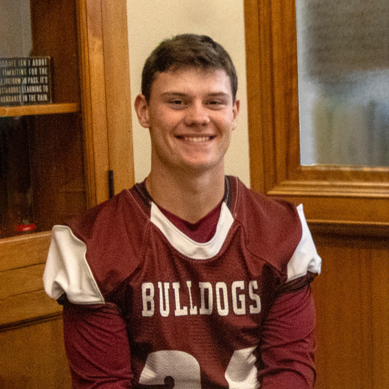 Adam Cook wearing Bulldogs football jersey