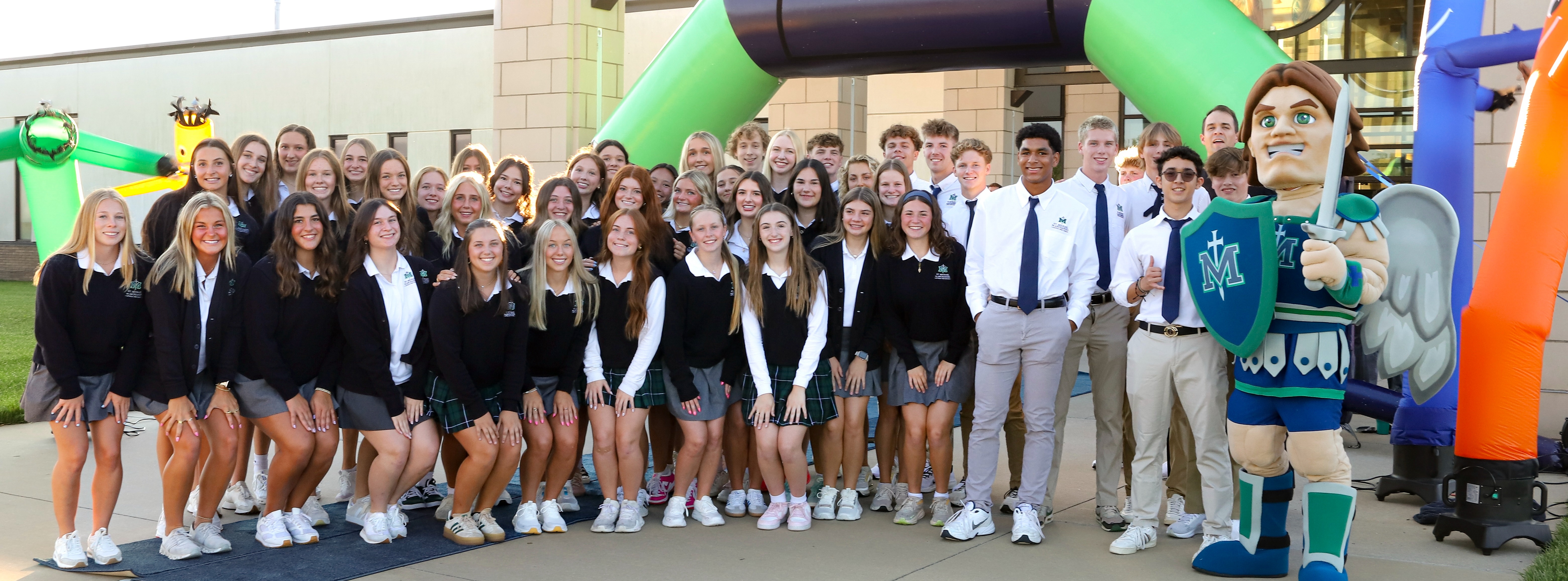 House and community captains pose outside of the school on New Student Orientation