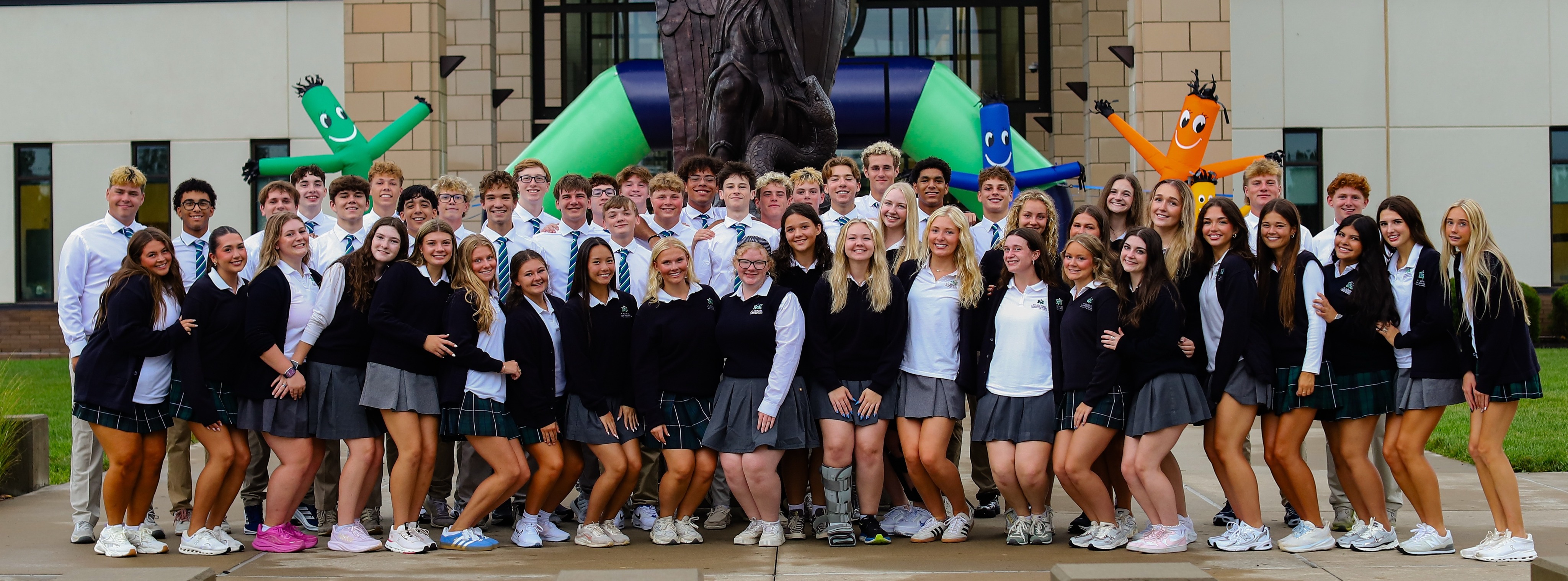 House and community captains pose outside of the school on New Student Orientation