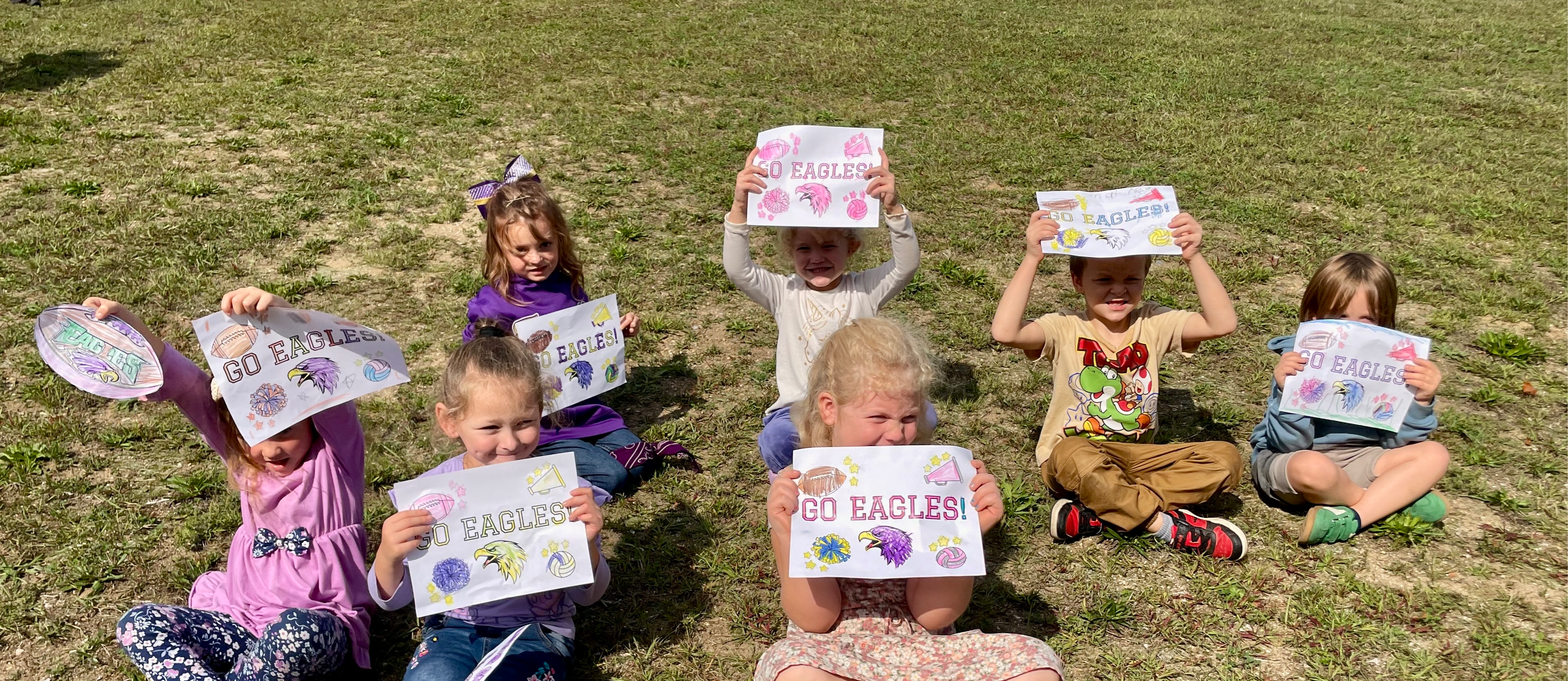 Kids holding signs