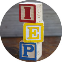 Circular thumbnail of colored letter blocks spelling IEP
