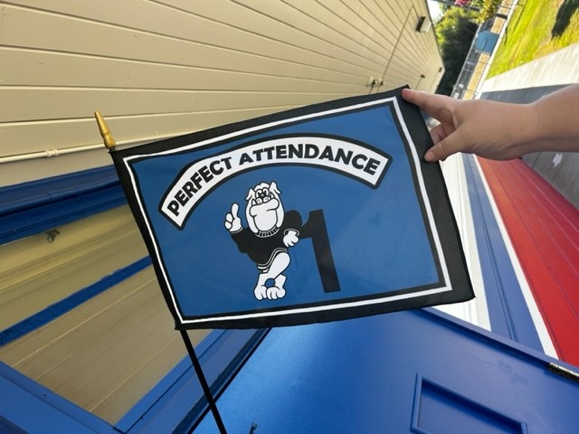Beard Elementary Flag with 'Perfect Attendance #1' written on it