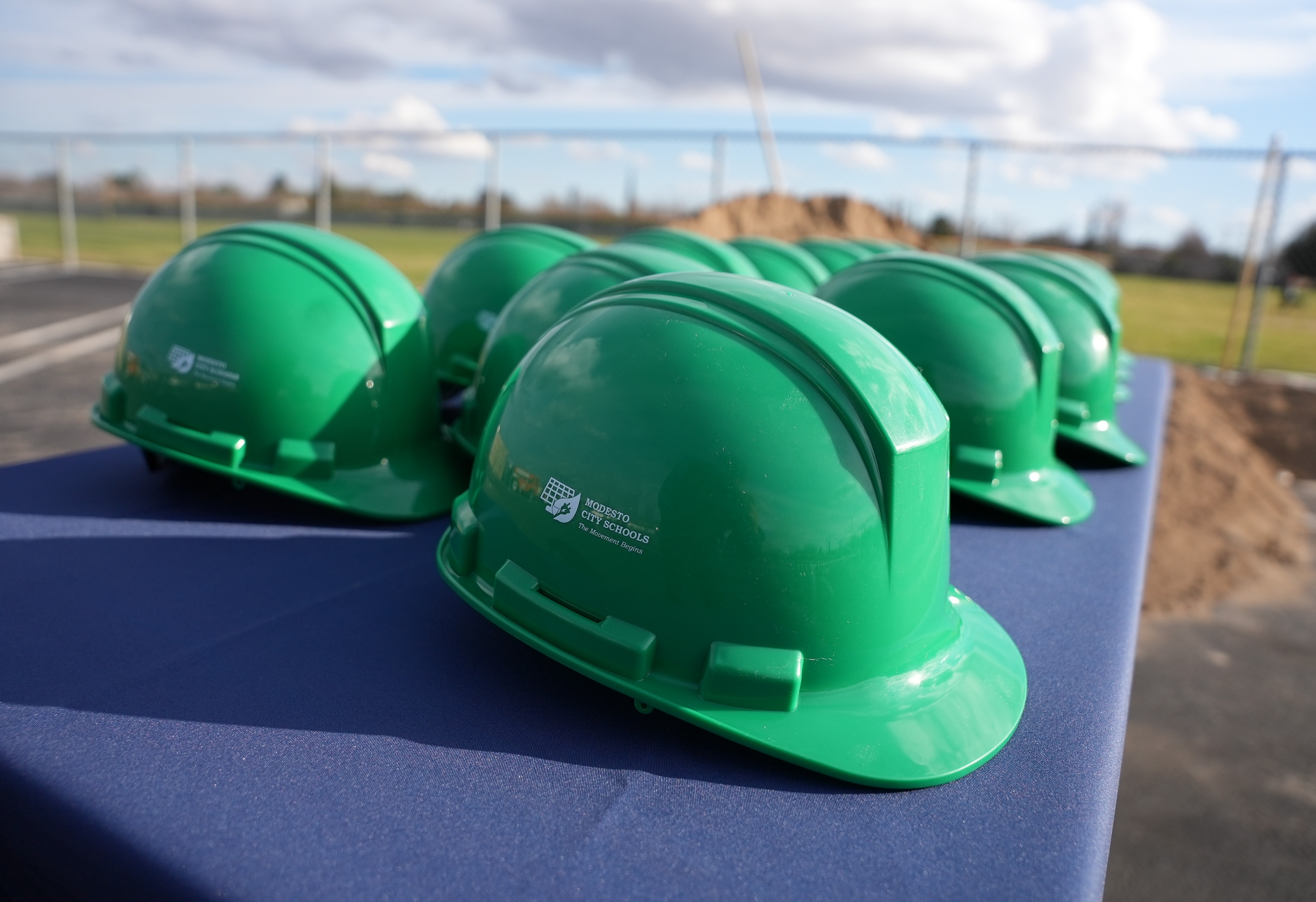 Green Construction Helmets on table