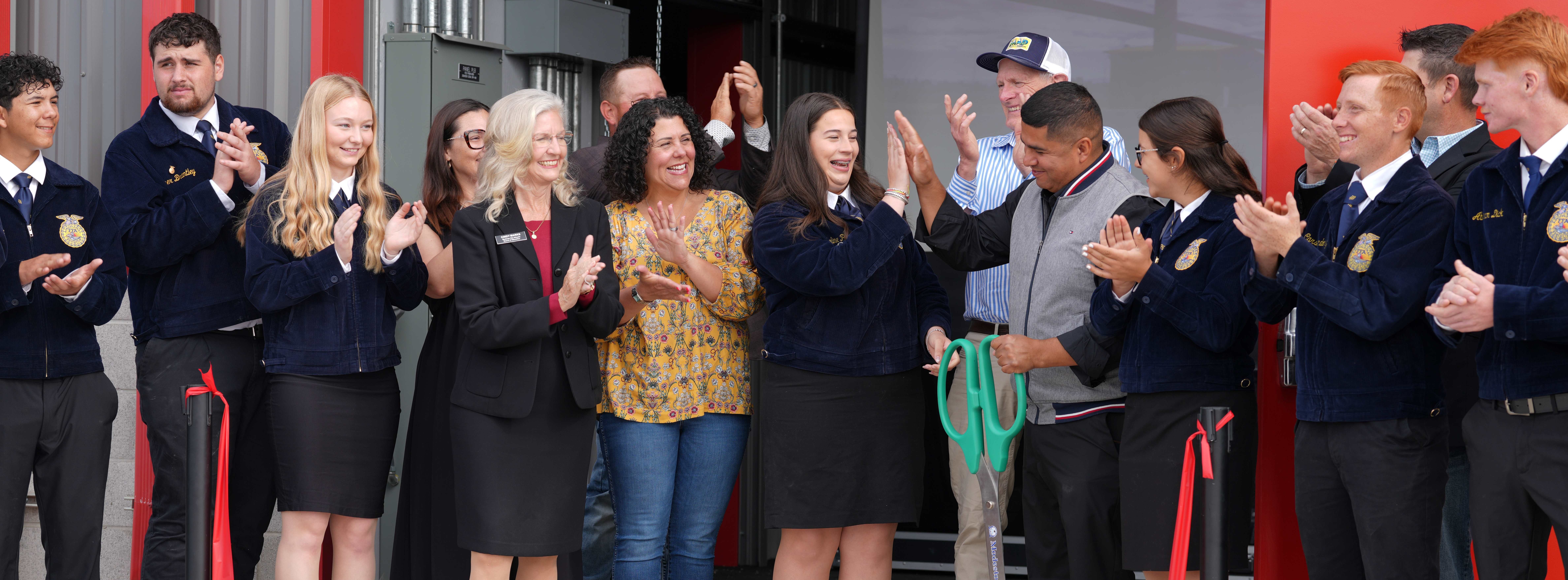 Board Trustees and FFA students cut ribbon at Modesto High Ag Farm Grand Opening