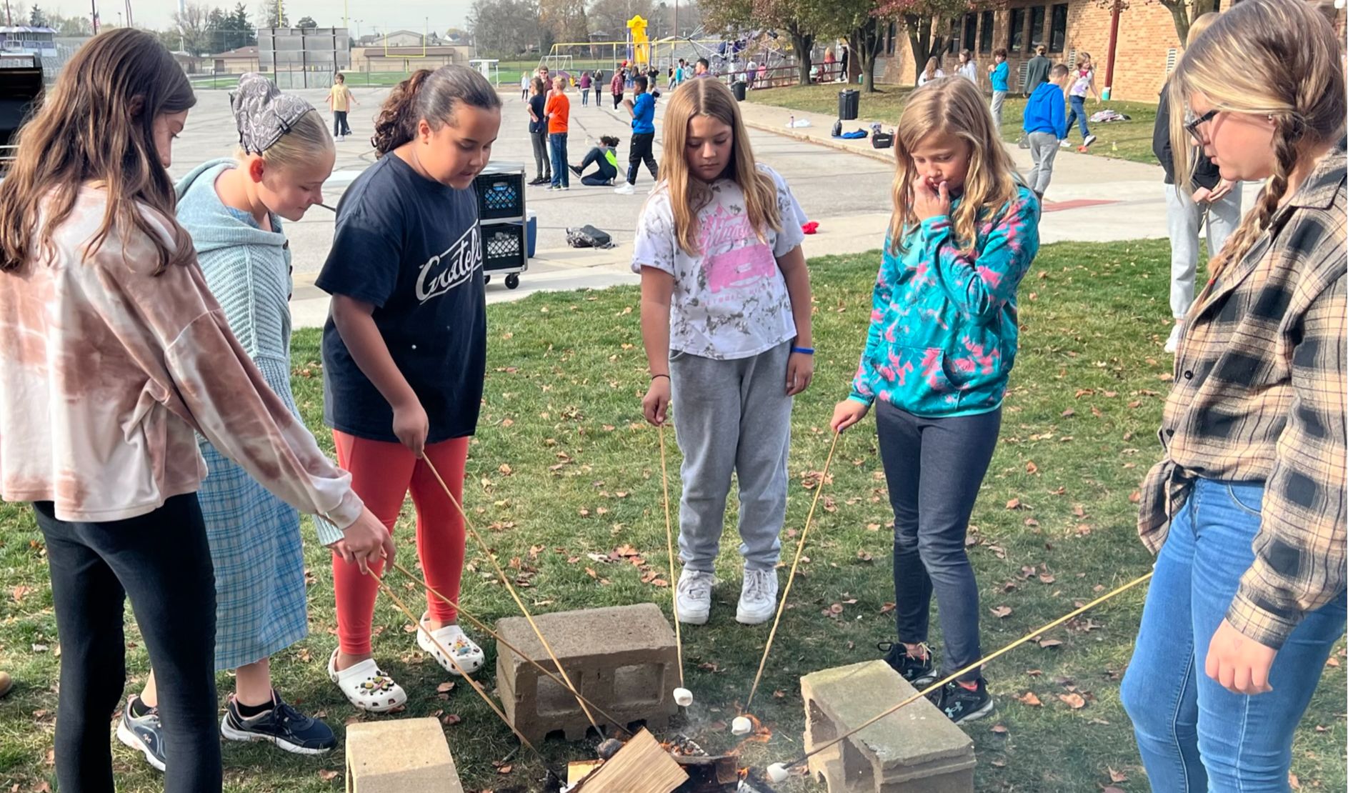 Roasting marshmallows during our November 2022 cookout.