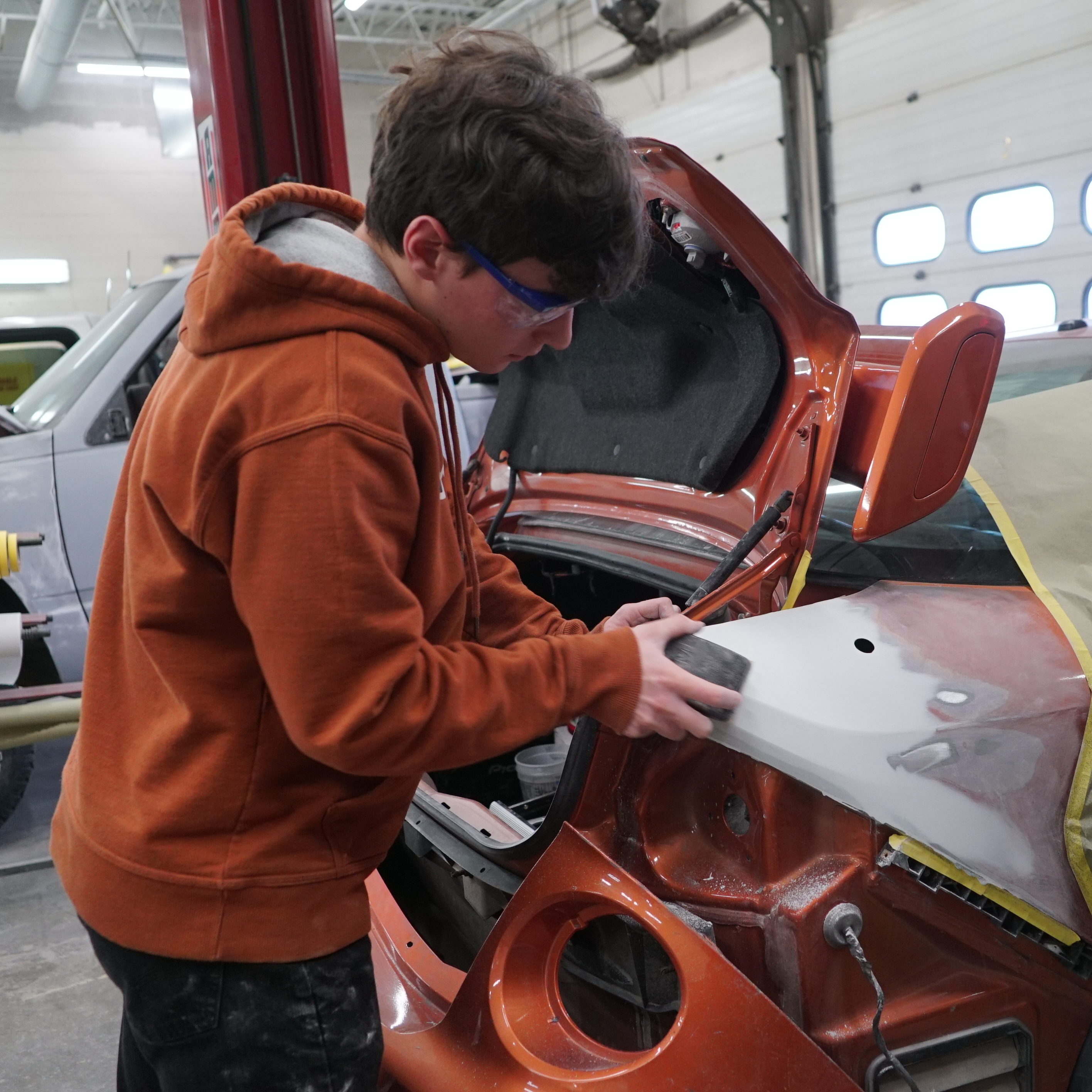student working on vehicle 