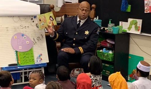 Real Men Read with a police  officer.