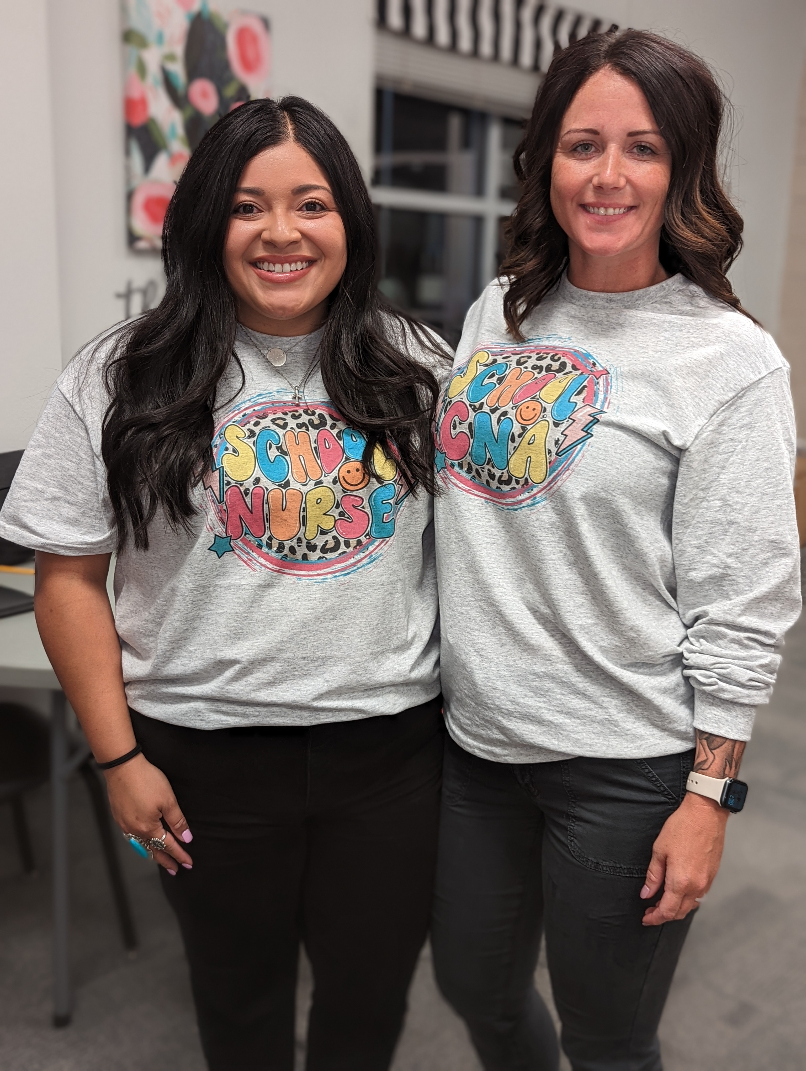 Nurse Kel standing next to Nurse Kim