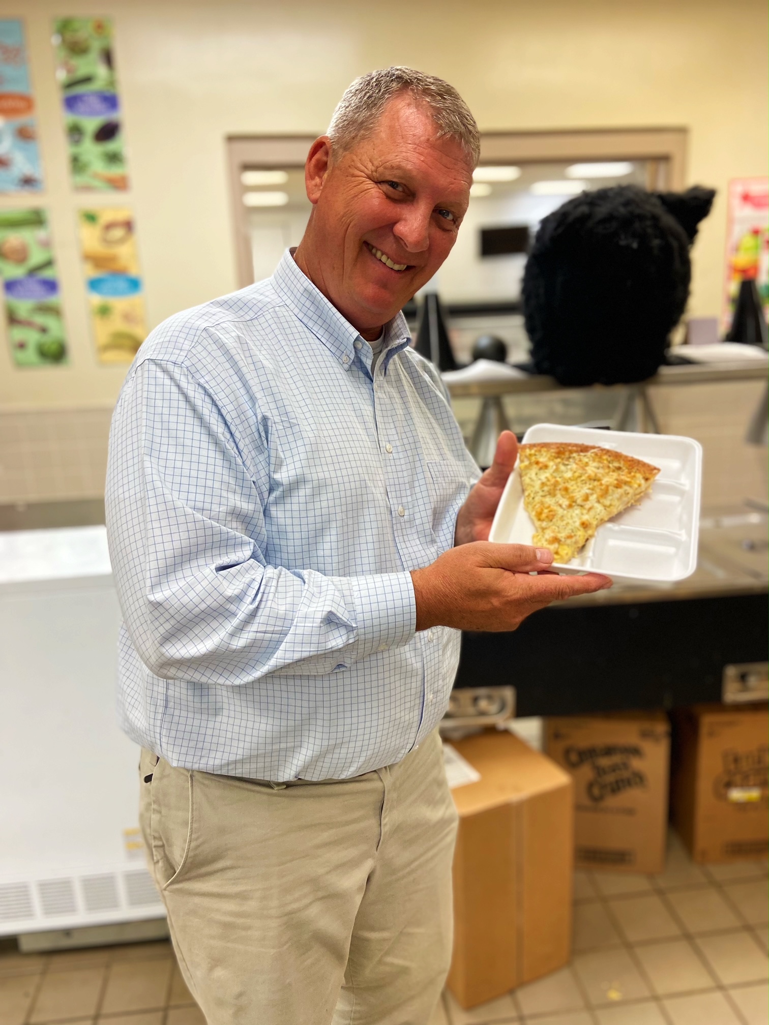 Dr. Hancock trying mac and cheese pizza! 