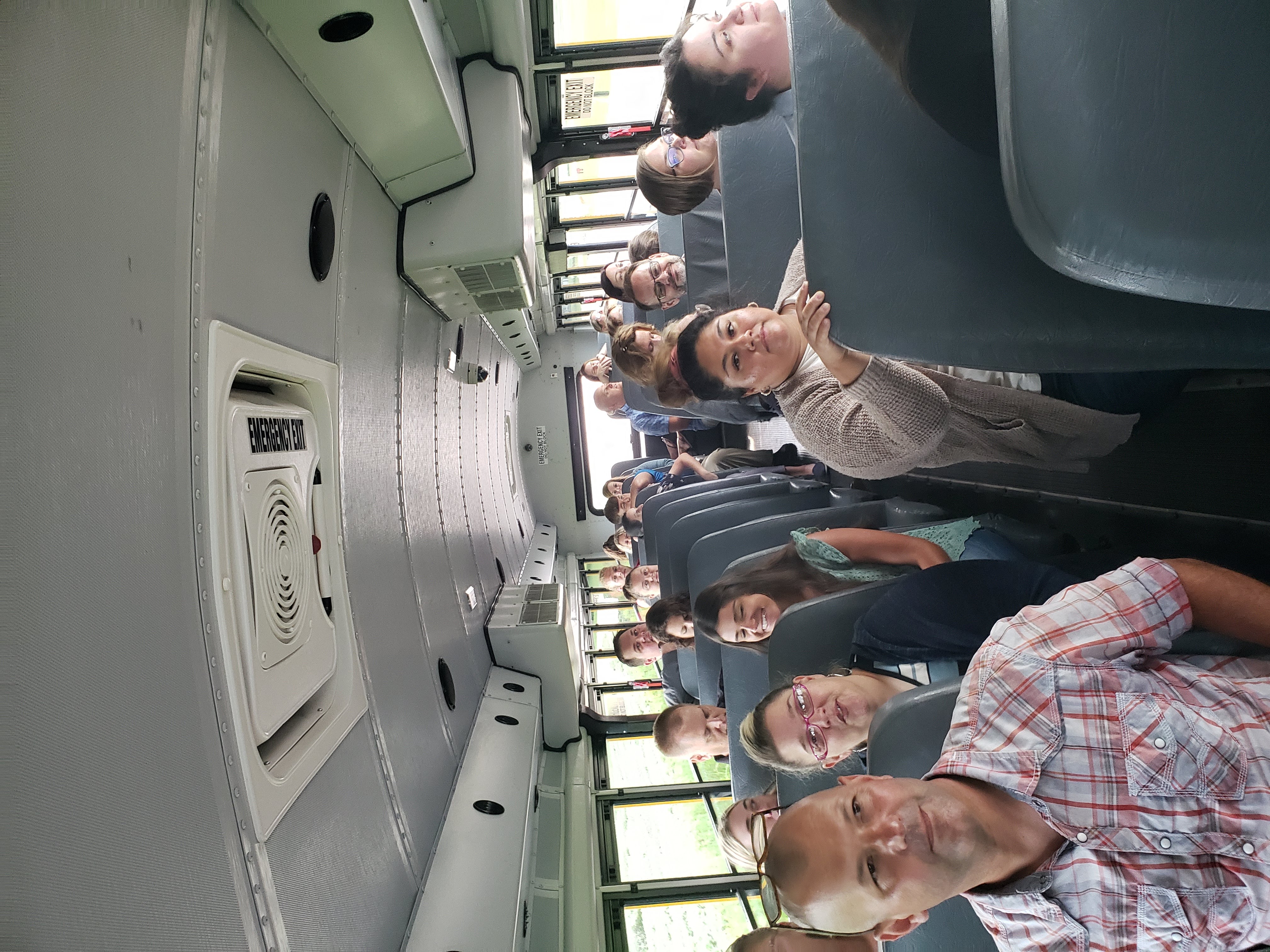 Teachers riding on a school bus