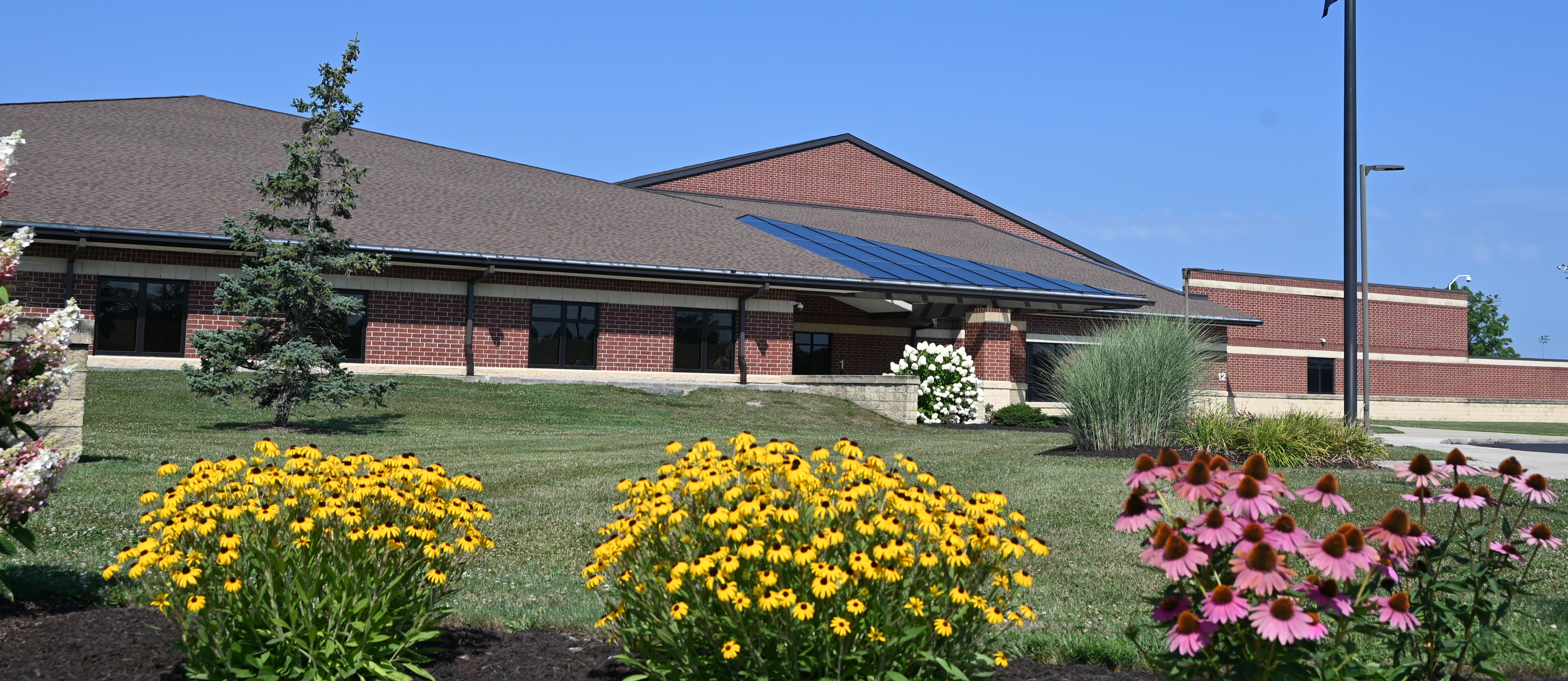building with flowers in front