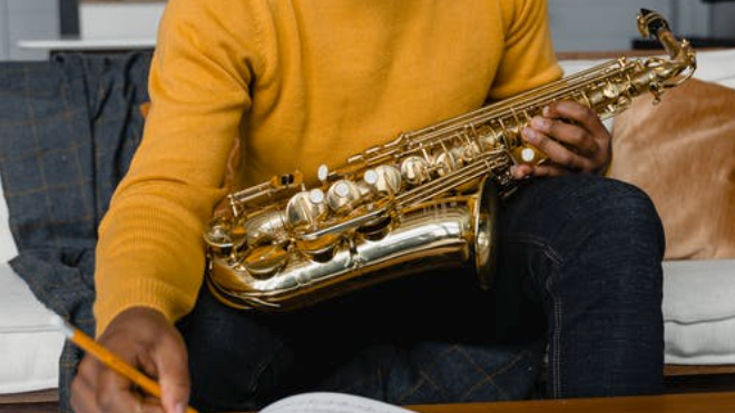 A man holding a saxophone